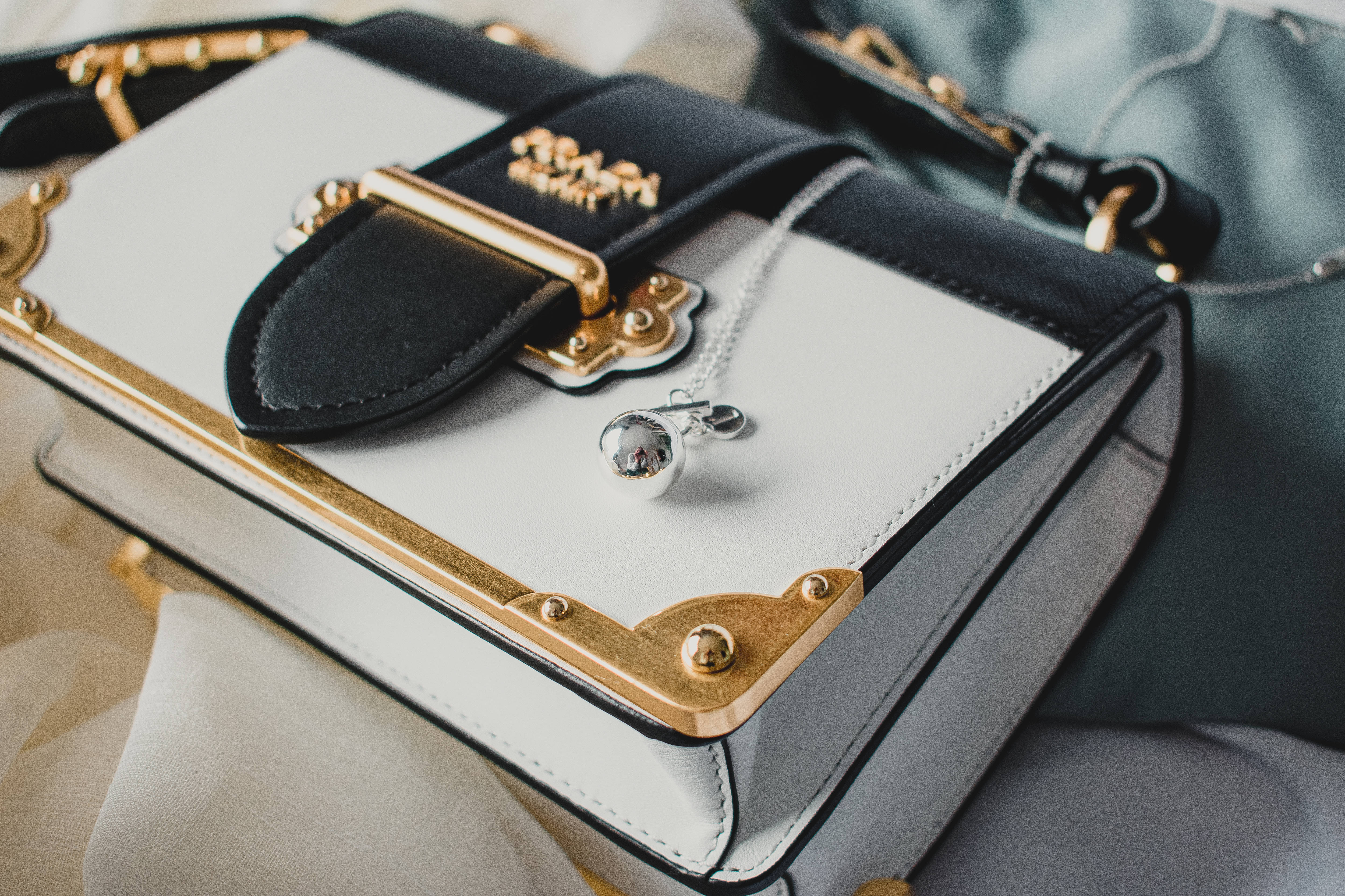 Prada, gold hardware, silver pendant, 4K Desktop Wallpaper