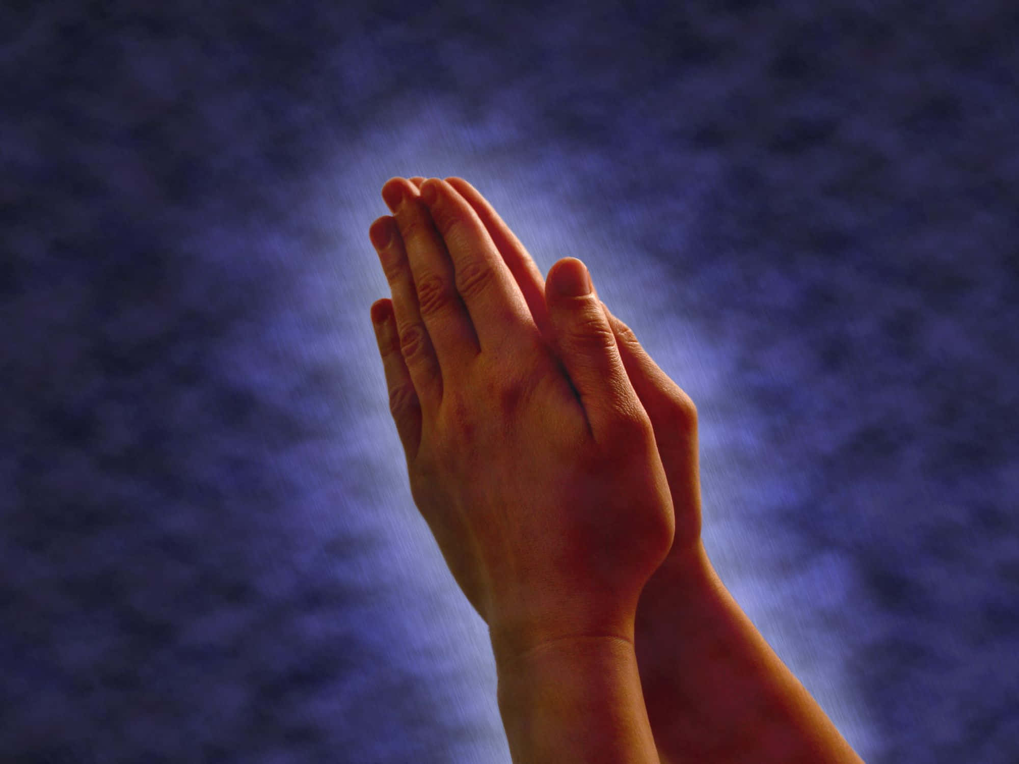 Praying Hands, deep blue textured background, soft glowing light, Full HD Desktop Wallpaper
