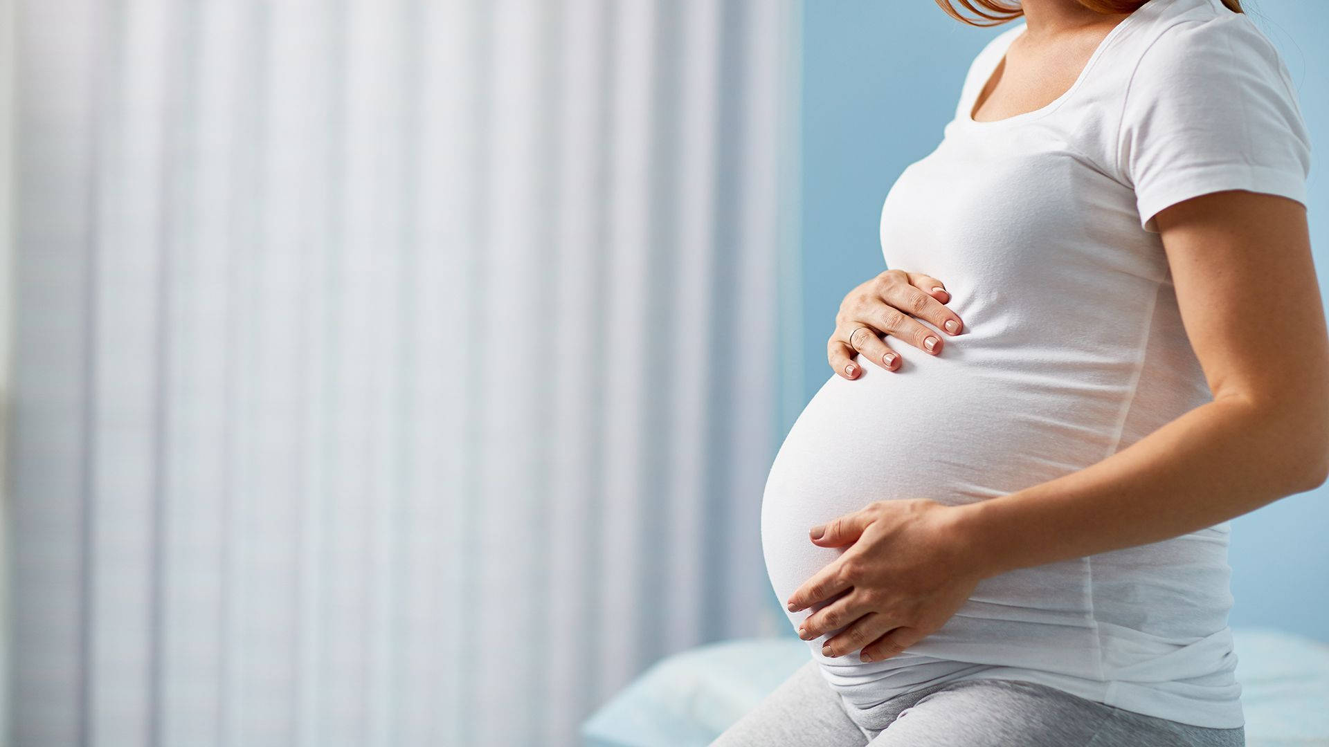 pregnant belly, white tshirt, soft blue wall, Full HD Desktop Wallpaper