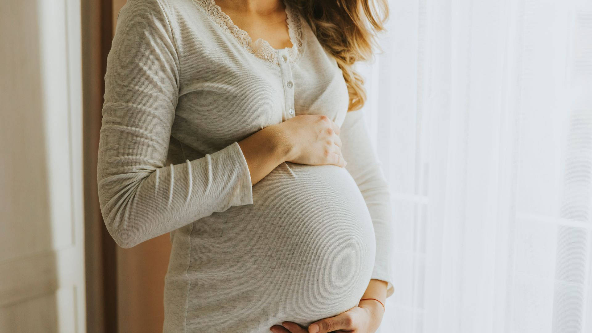 pregnant woman, soft gray long-sleeve shirt, bright window, Full HD Desktop Wallpaper
