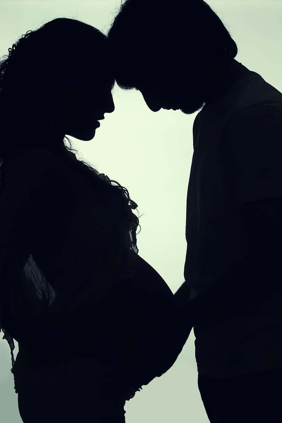 pregnant couple, silhouette, foreheads touching, HD Phone Wallpaper