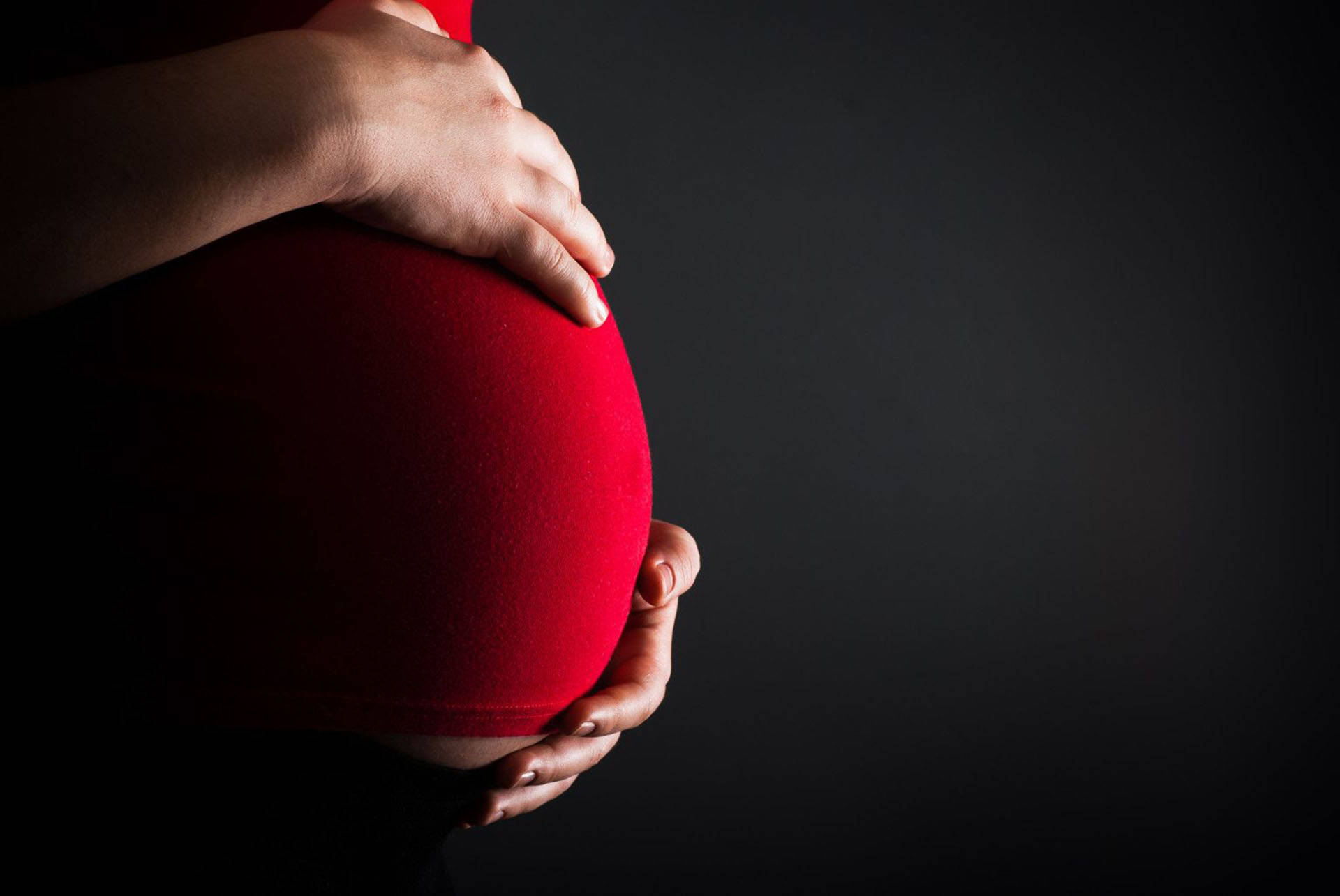 pregnant woman, glowing red belly, stark black background, Full HD Desktop Wallpaper