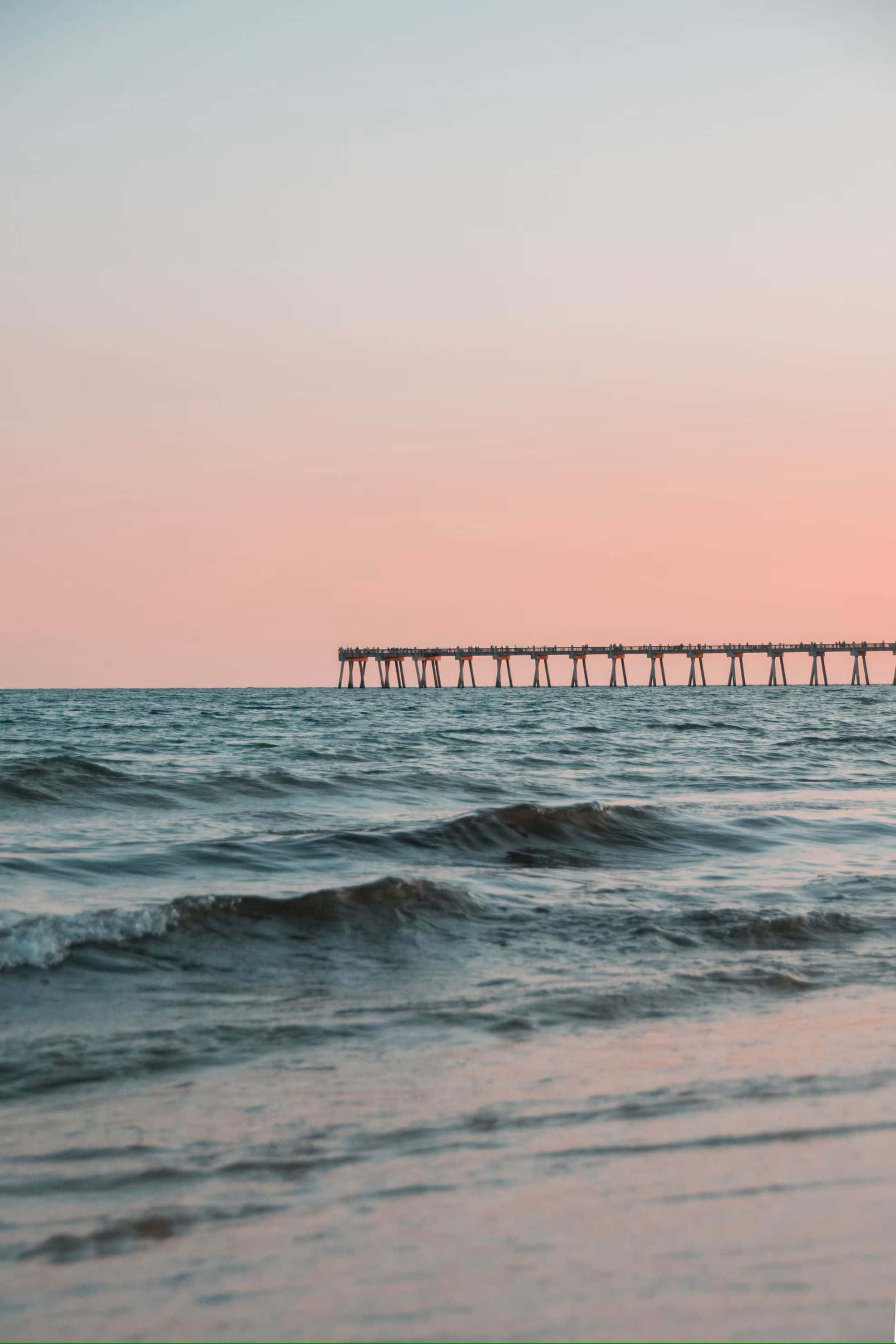 Serene Sunset Pier Beach Waves, wooden pier, calm ocean waters, 2K Phone Wallpaper