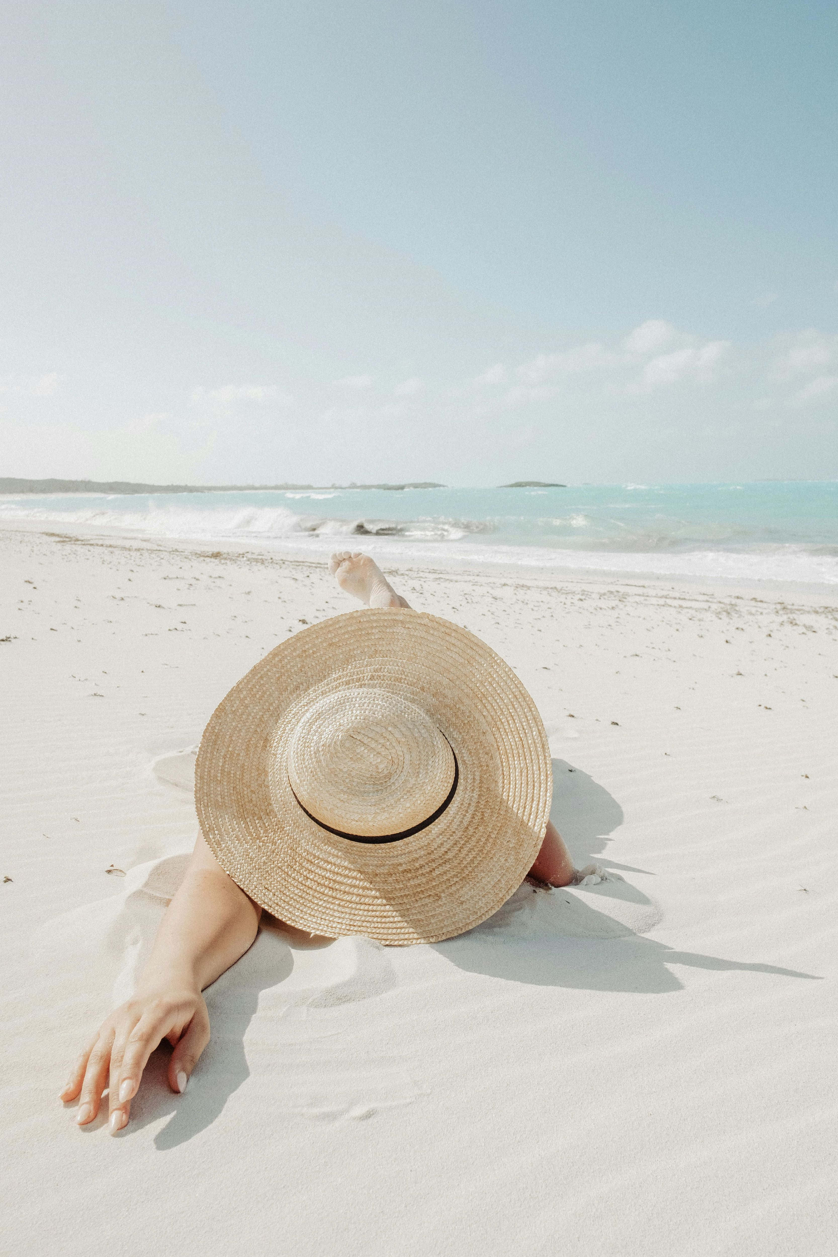 wide-brimmed straw hat, pristine white sand, turquoise ocean waves, 4K Phone Wallpaper
