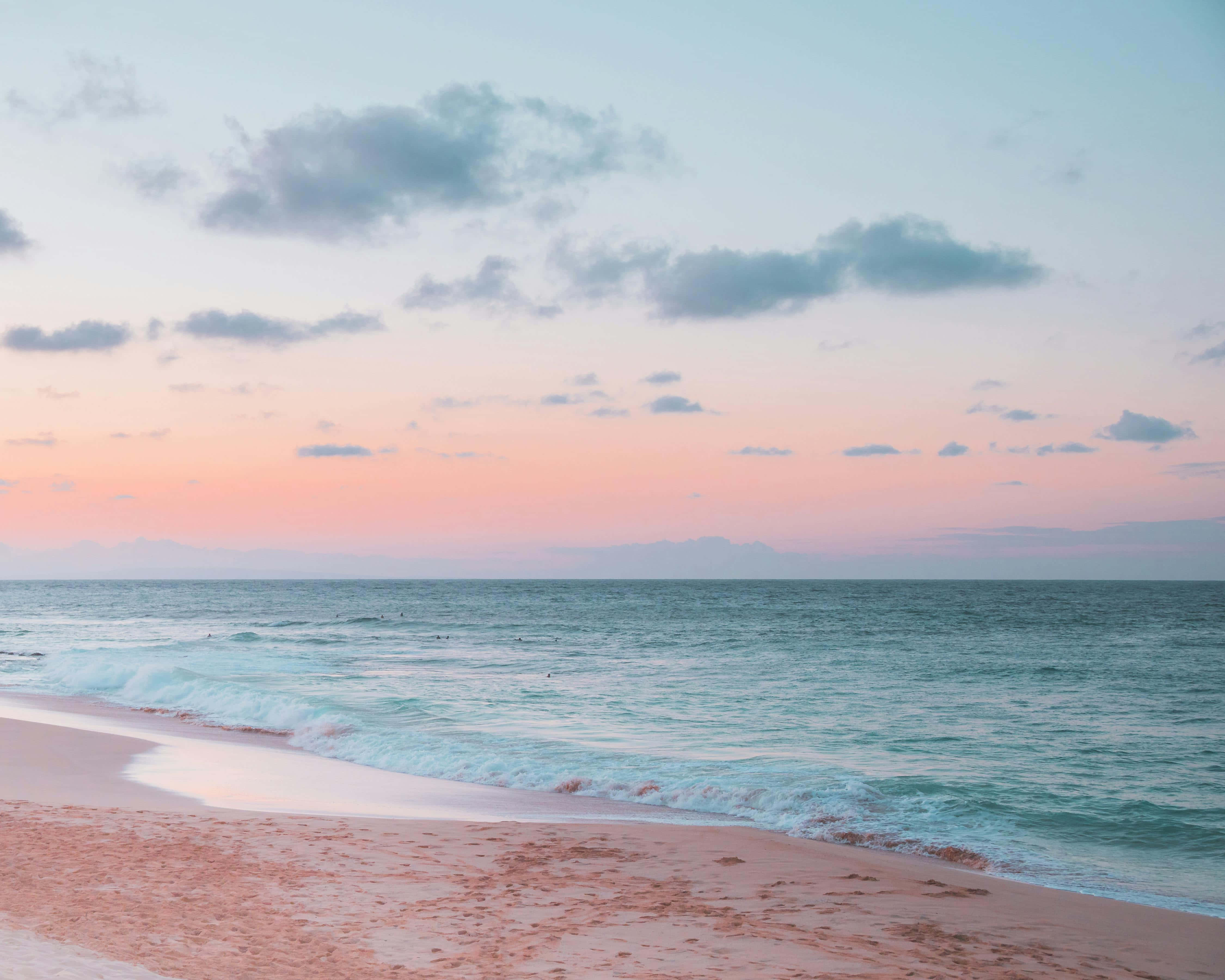 pastel sunset beachscape, soft pink and teal waves, pale pink sand beach, 4K Desktop Wallpaper