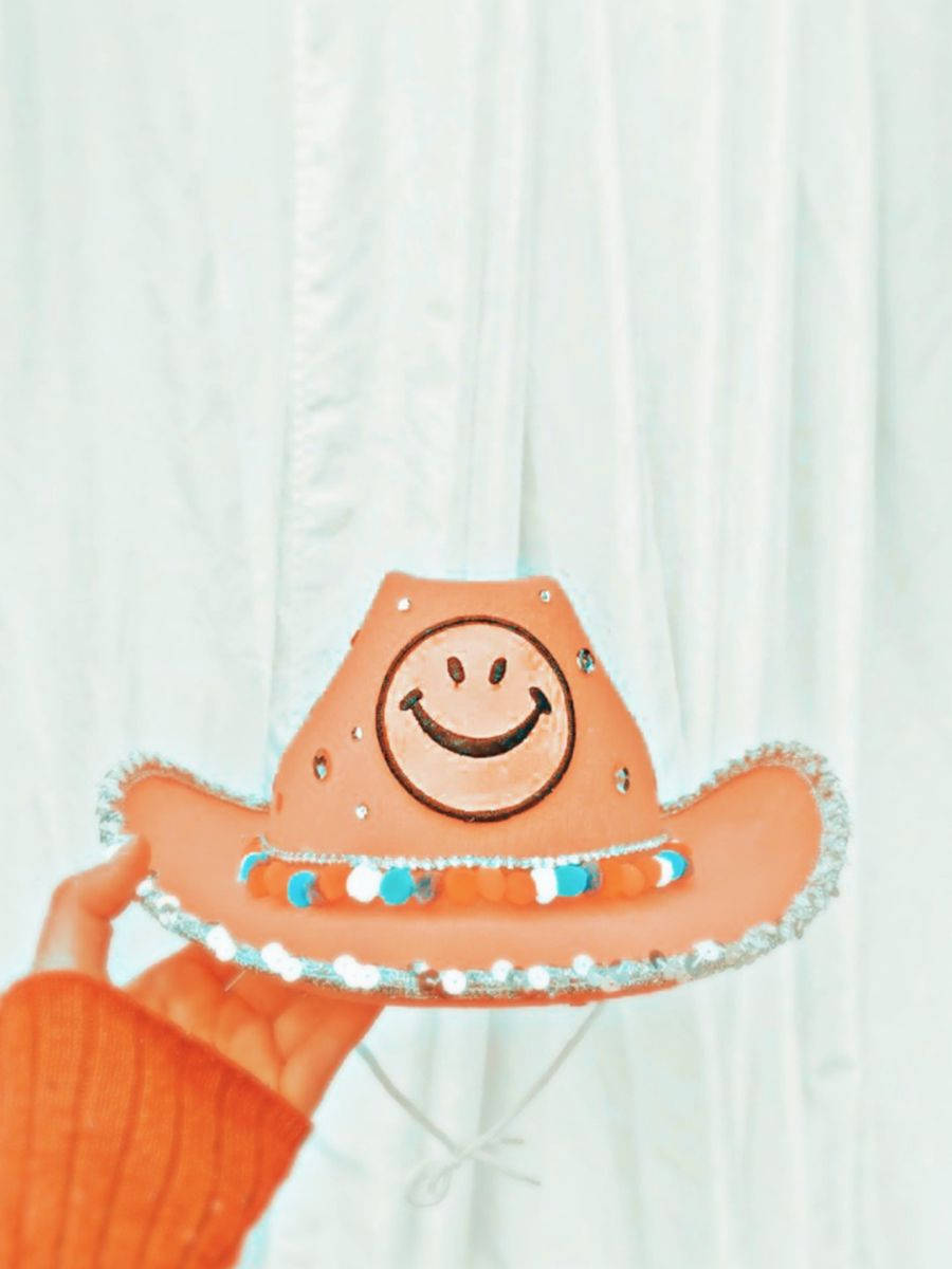 orange cowboy hat, smiling face, colorful bead trim, SD Phone Wallpaper