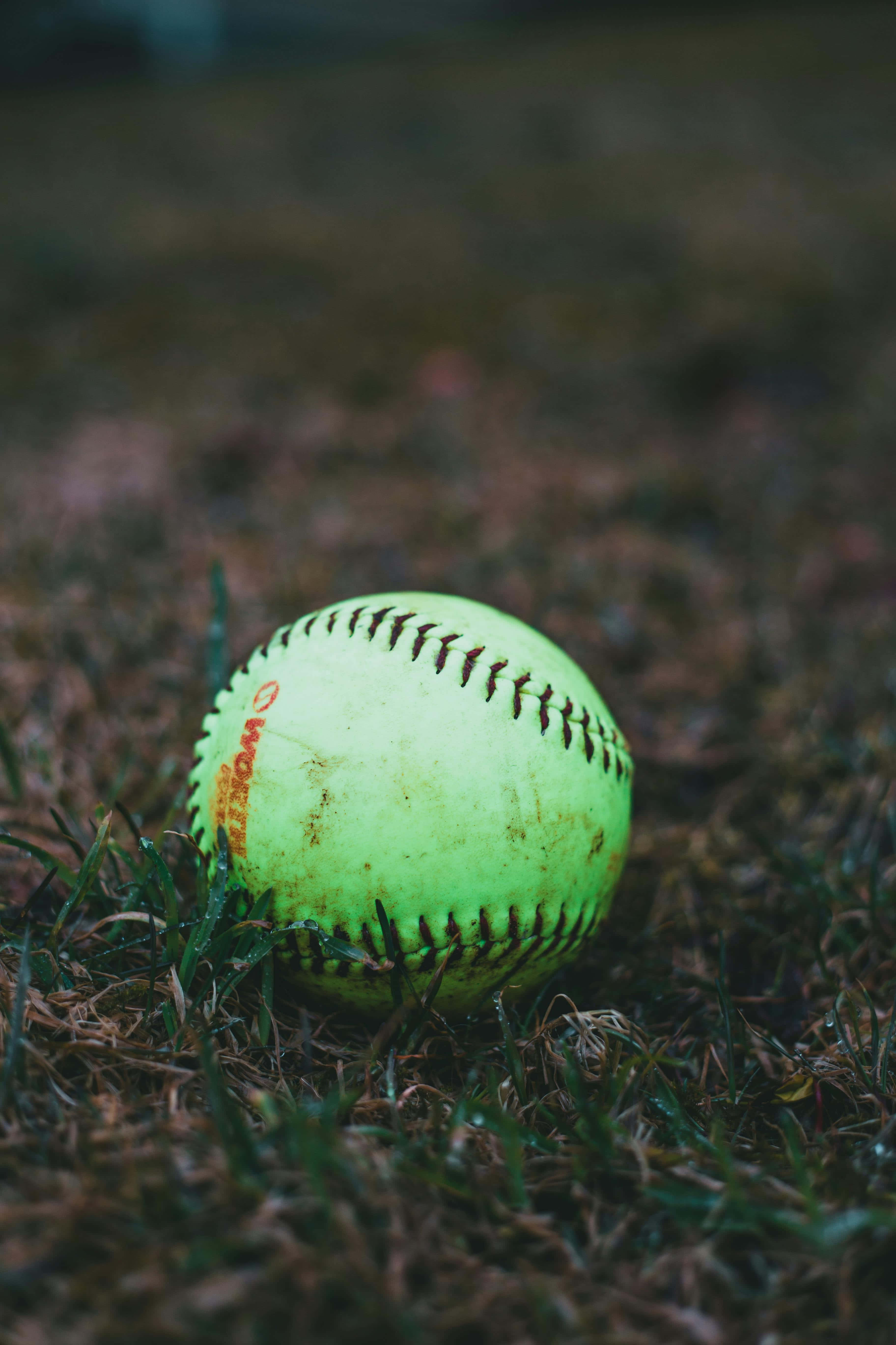 neon yellow, red stitching, patchy green and brown grass, 5K Phone Wallpaper