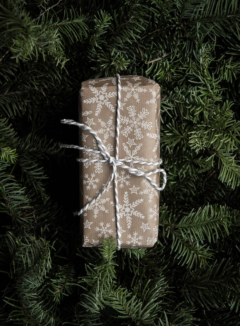 brown paper, white snowflake patterns, dark green pine needles, HD Phone Wallpaper