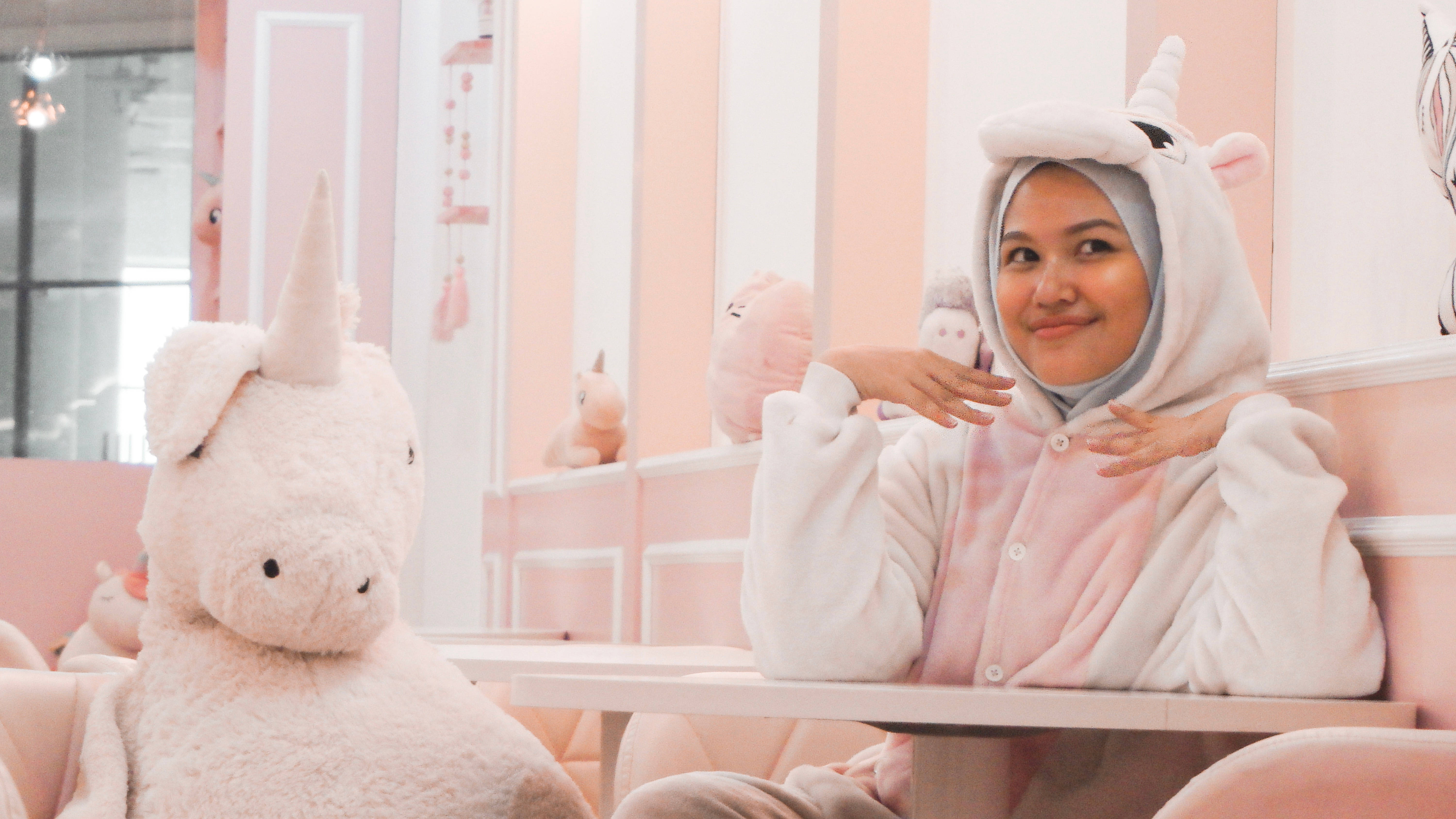 pastel pink cafe, giant plush unicorn, pink unicorn onesie, 5K Desktop Wallpaper