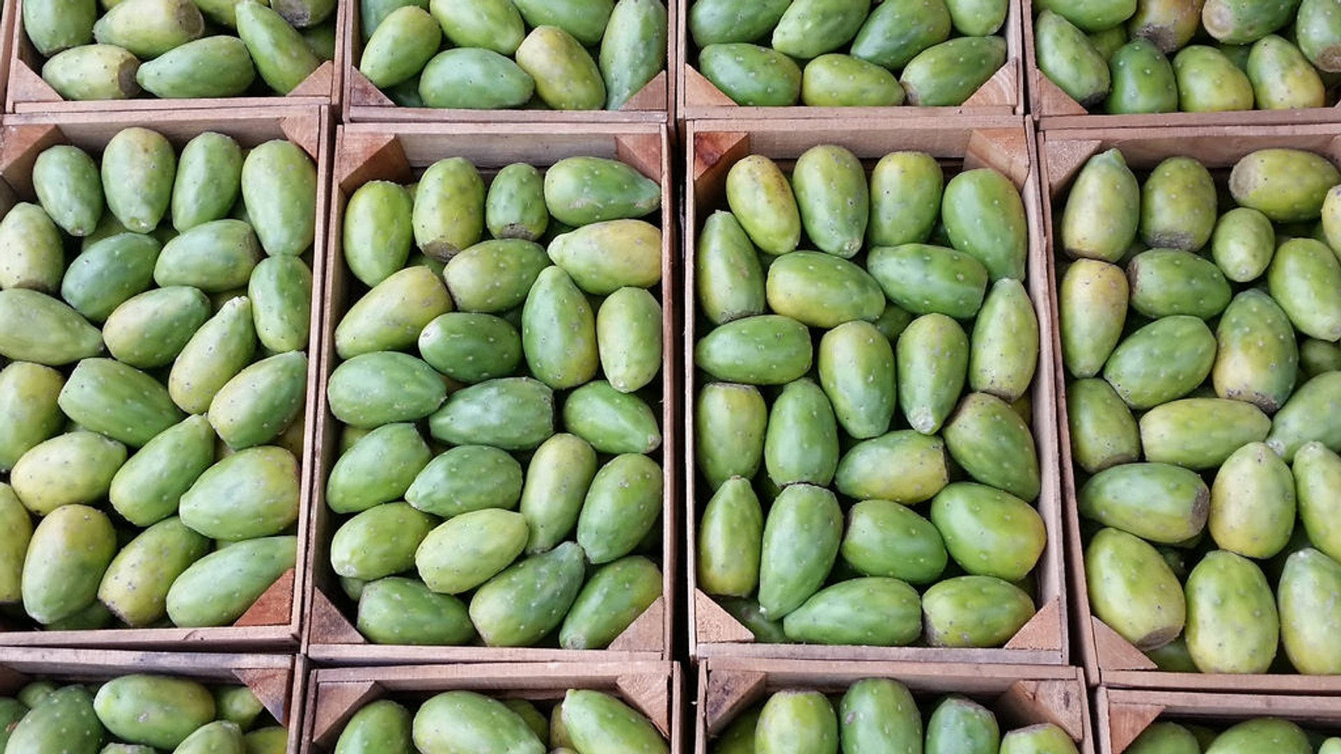 prickly pear cactus fruit, wooden crates, vibrant market display, Full HD Desktop Wallpaper
