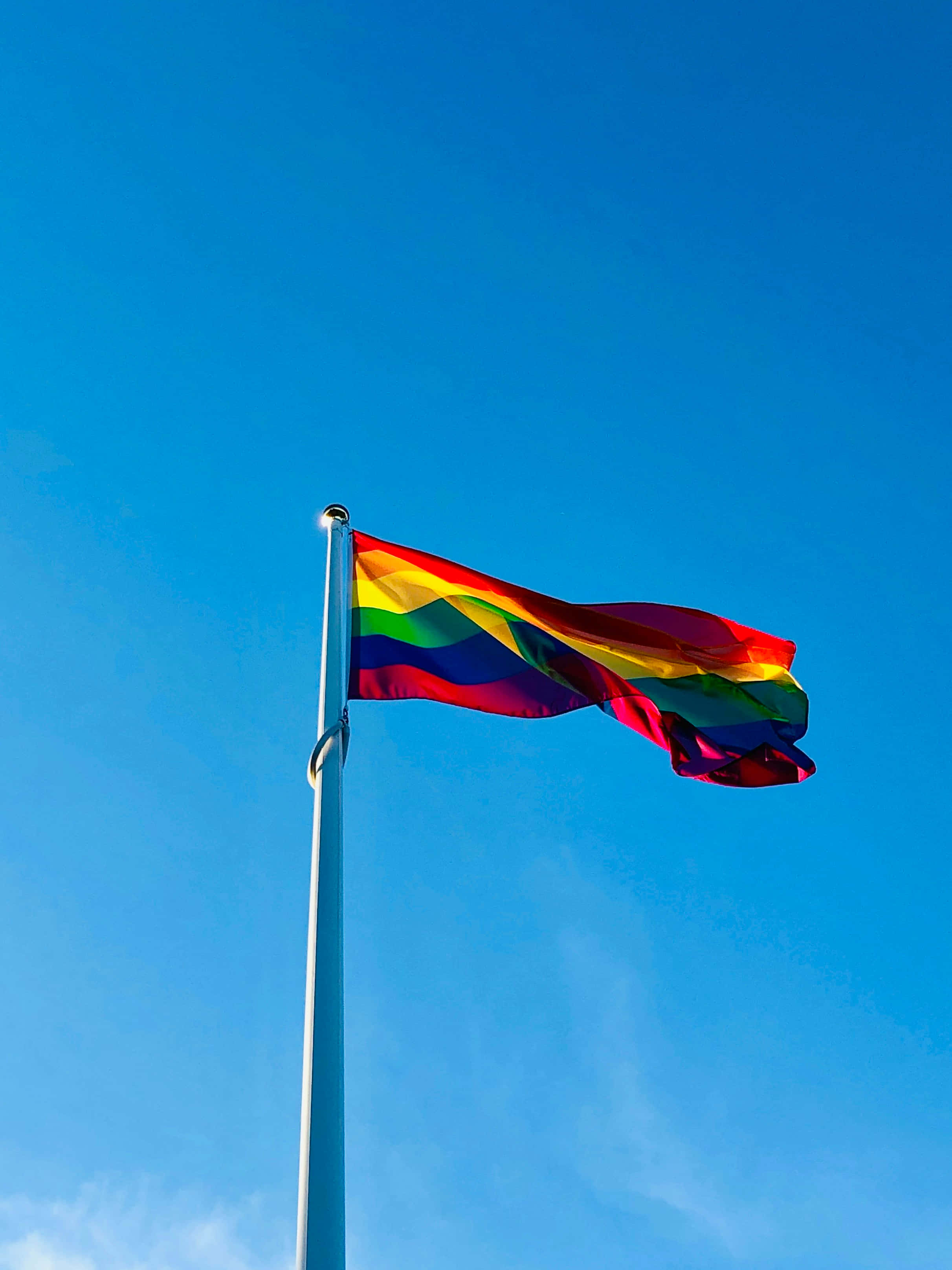 Pride flag, blue sky, wispy clouds, 2K Phone Wallpaper