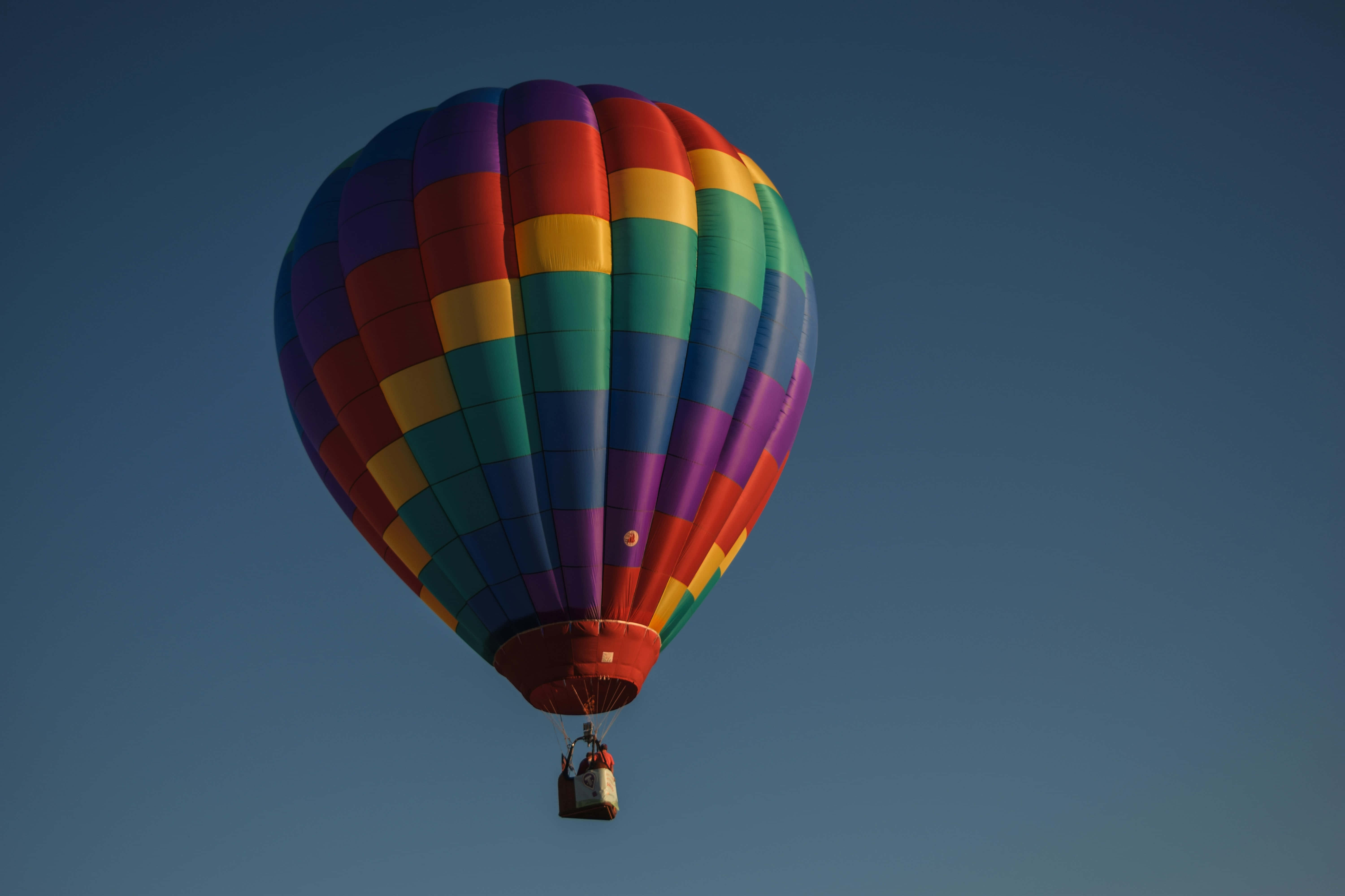 rainbow hot air balloon, clear blue sky, dusk, 5K Desktop Wallpaper
