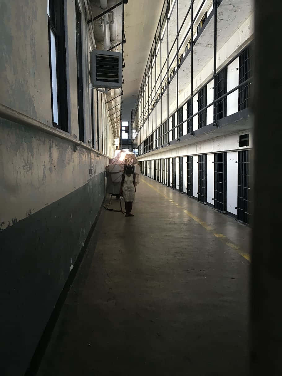 prison, dimly lit prison corridor, barred cells, SD Phone Wallpaper