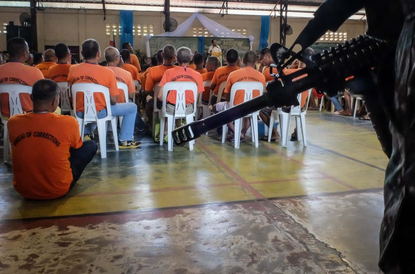 orange uniforms, white plastic chairs, speaker, HD Desktop Wallpaper