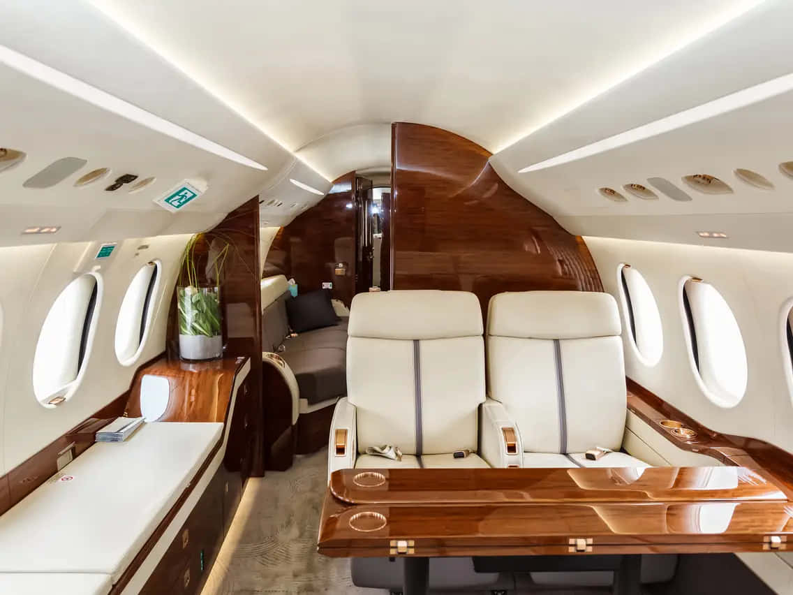 private jet, cream leather seats, polished wood paneling, SD Desktop Wallpaper