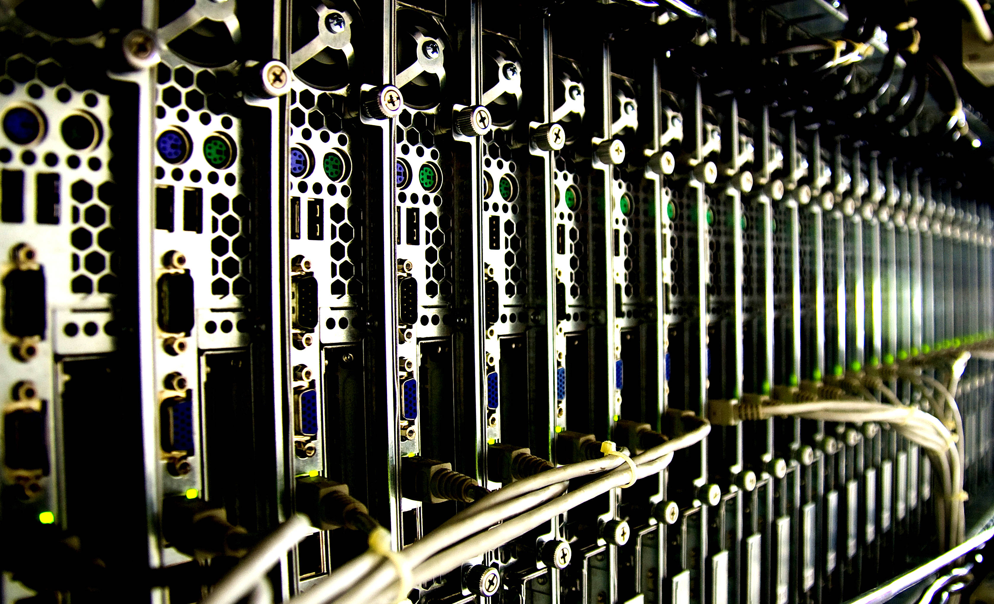 server racks, glowing indicator lights, cables, 2K Desktop Wallpaper