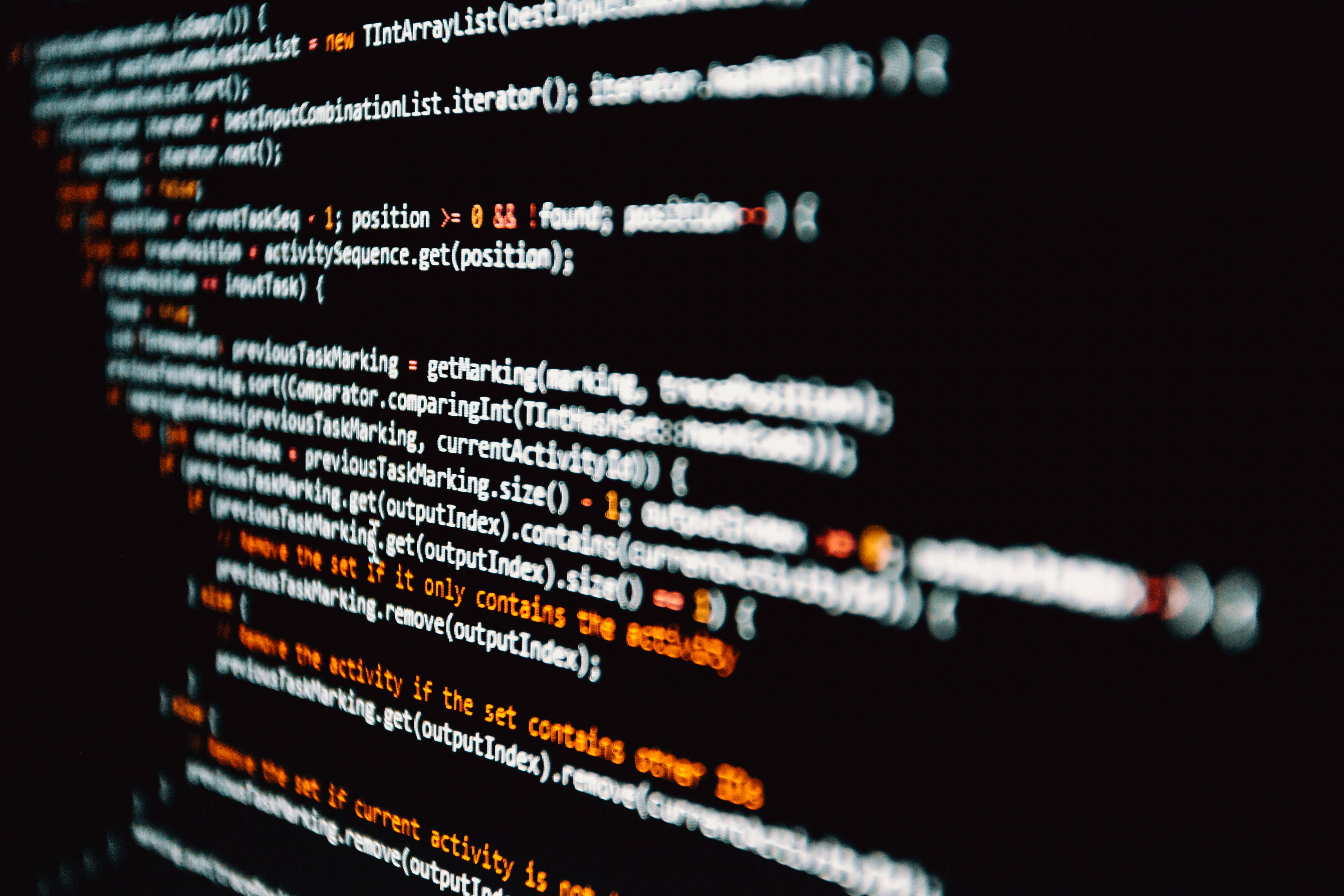 glowing computer code lines, orange and white text, dark screen, 4K Desktop Wallpaper