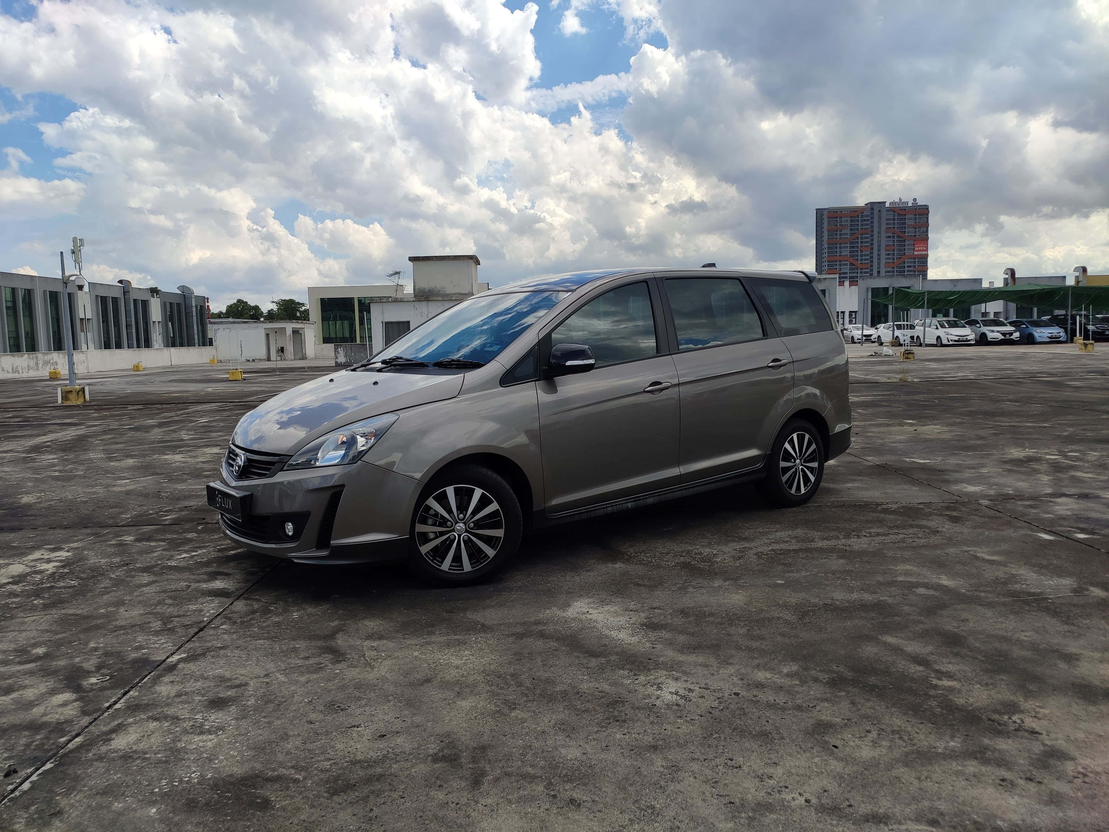 Proton Exora, sleek silver minivan, vast concrete lot, 4K Desktop Wallpaper