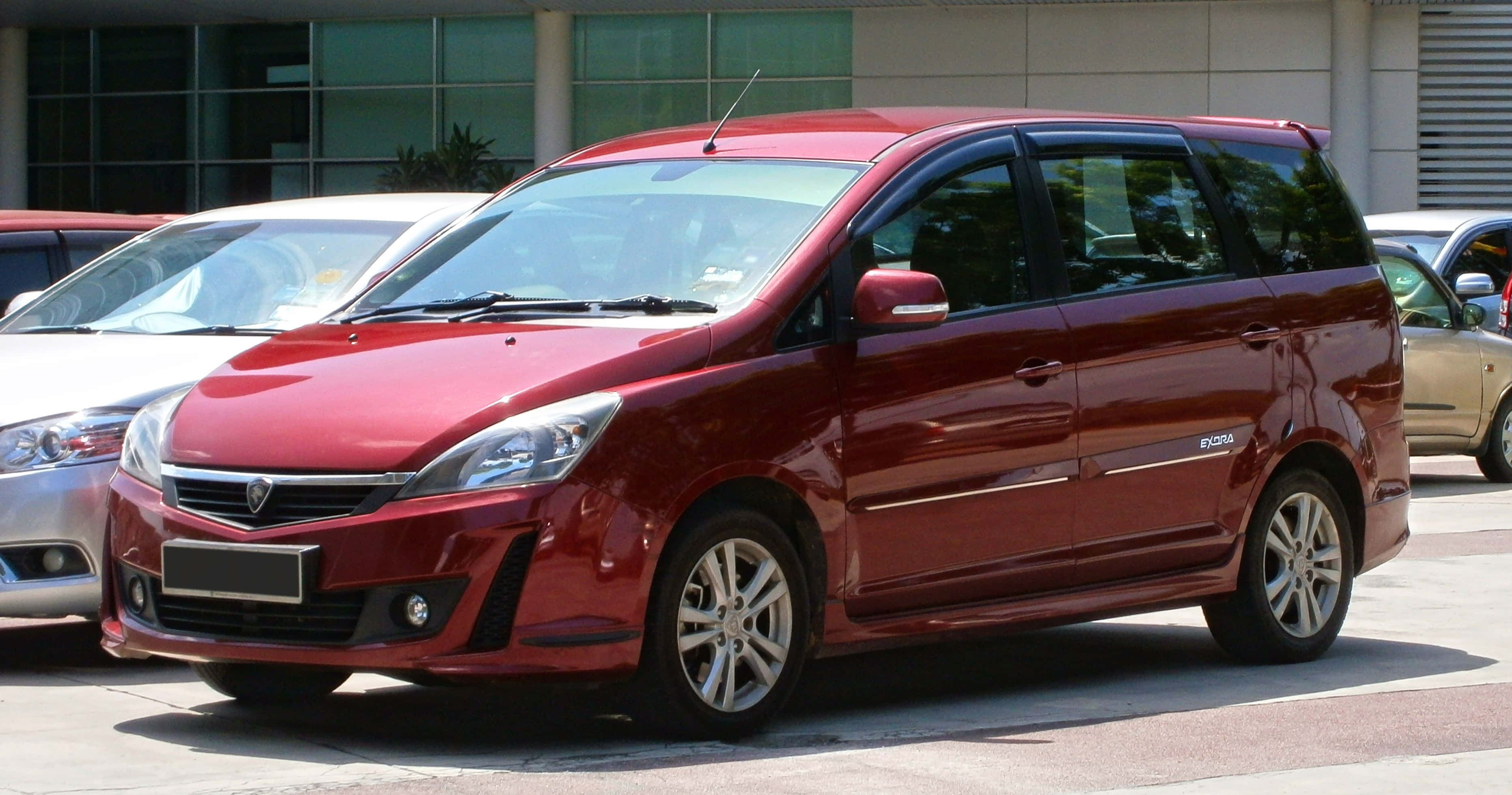 Proton Exora, glossy red, modern urban lot, 2K Desktop Wallpaper