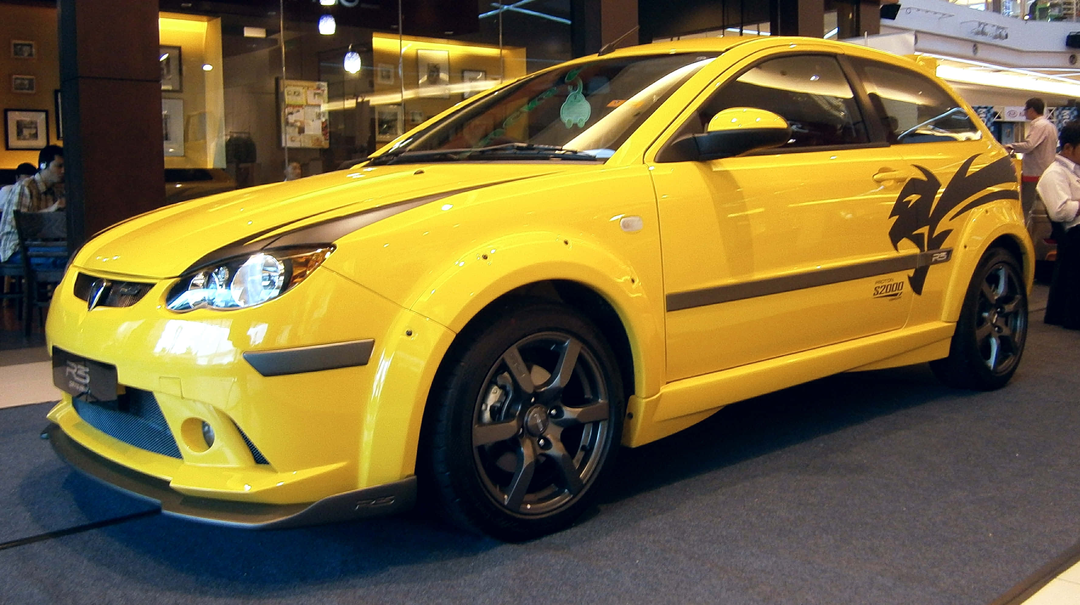 Proton Satria-Neo, bright yellow, black racing stripes, 2K Desktop Wallpaper