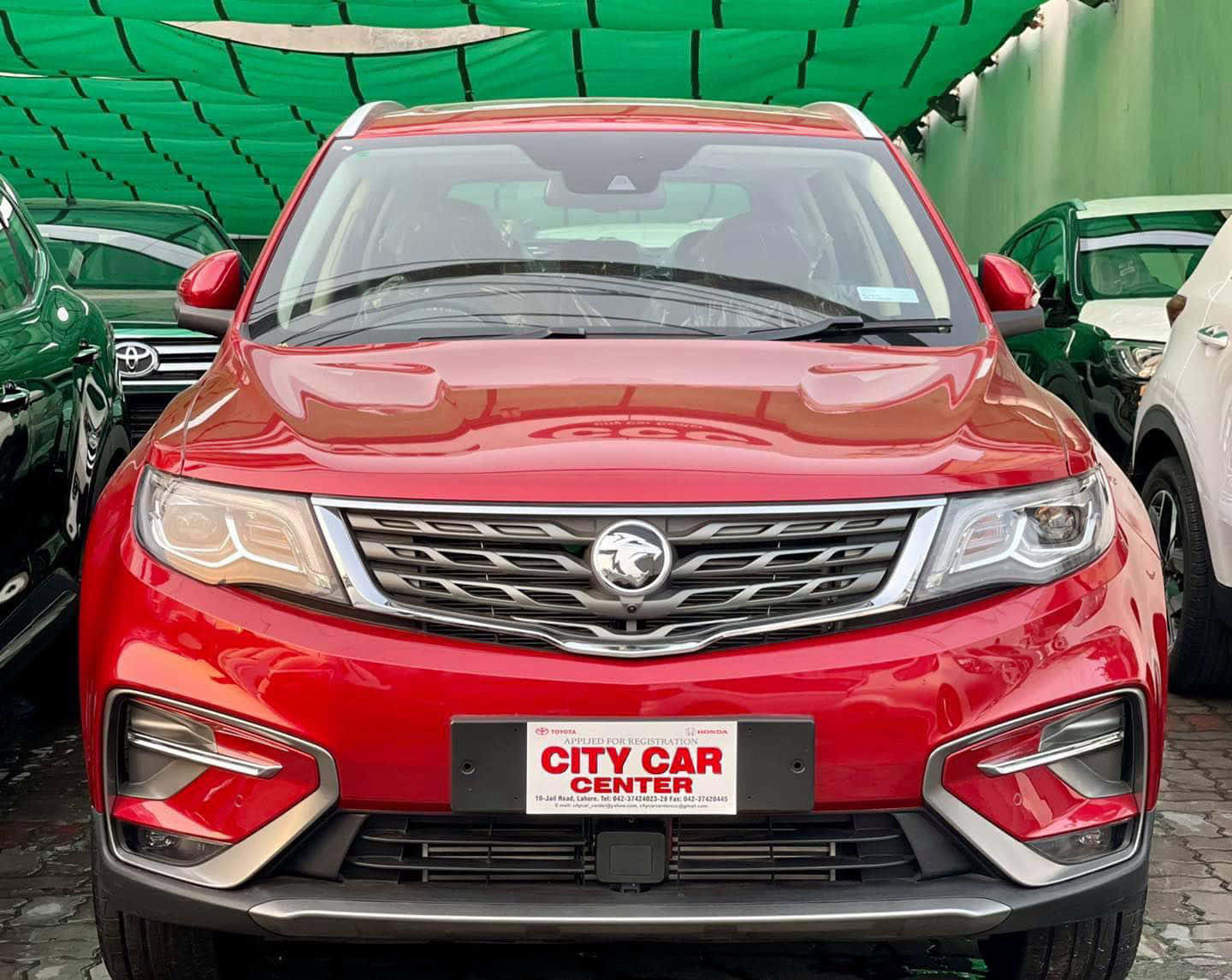 Proton X70, shiny red SUV, green canopy, HD Desktop Wallpaper