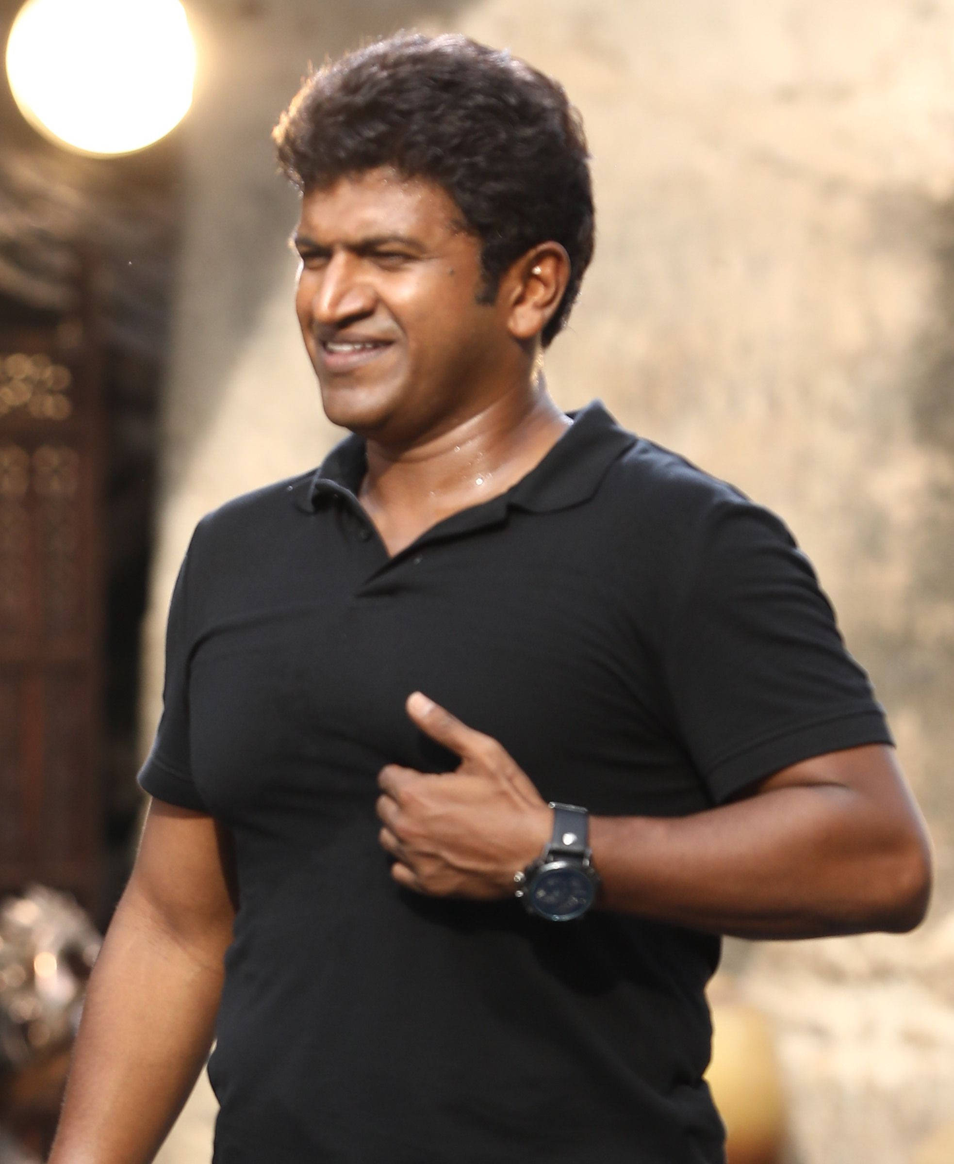 Puneeth Rajkumar, black polo shirt, stage lighting, Full HD Phone Wallpaper