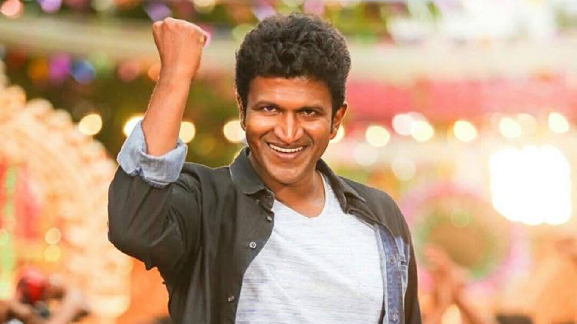 Puneeth Rajkumar, colorful bokeh background, curly hair, Full HD Desktop Wallpaper