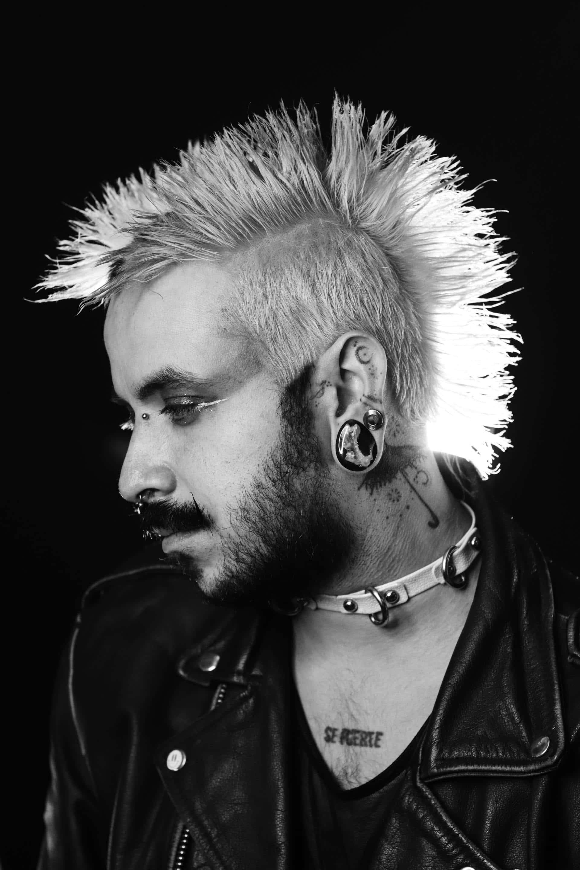 black and white portrait, spiked mohawk, multiple ear cartilage piercings, 2K Phone Wallpaper