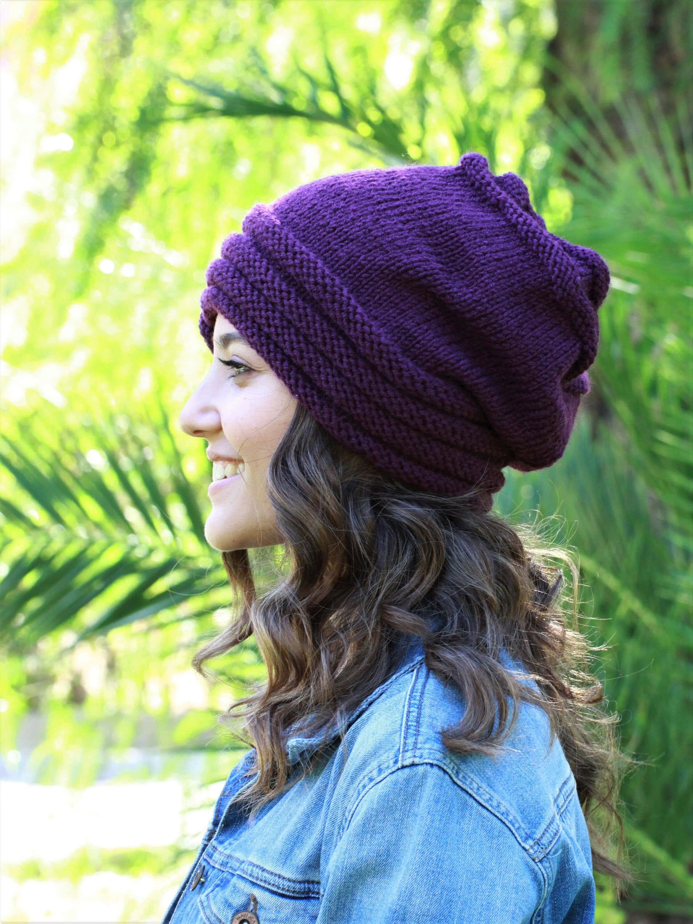 purple knit beanie, denim jacket, bright green palm frond backdrop, 2K Phone Wallpaper