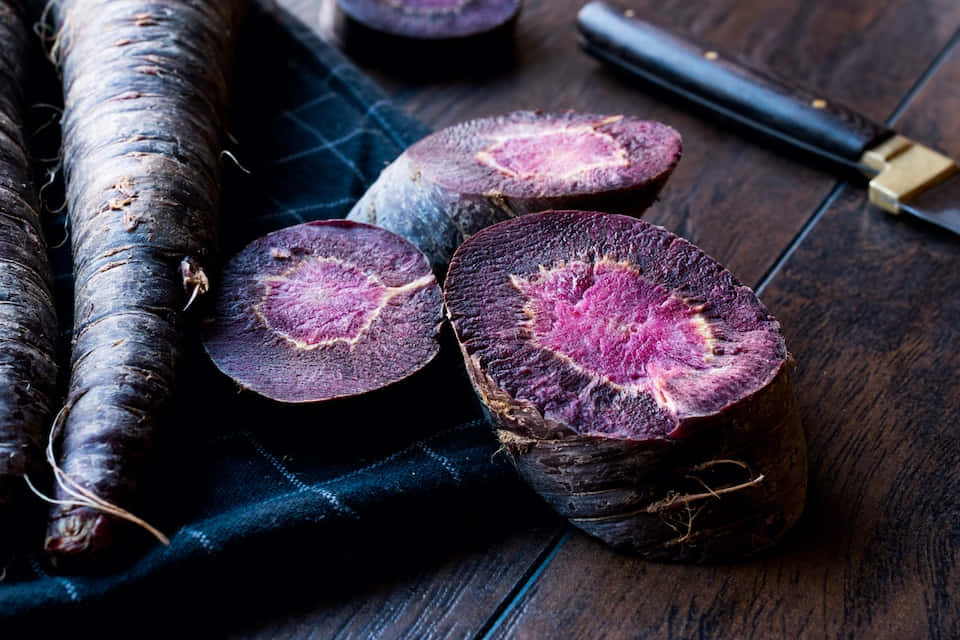 purple carrots, magenta interiors, dark wooden table, SD Desktop Wallpaper
