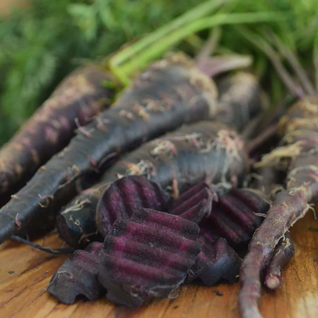 Purple Carrots, rustic wooden board, vibrant sliced interiors, SD Desktop Wallpaper