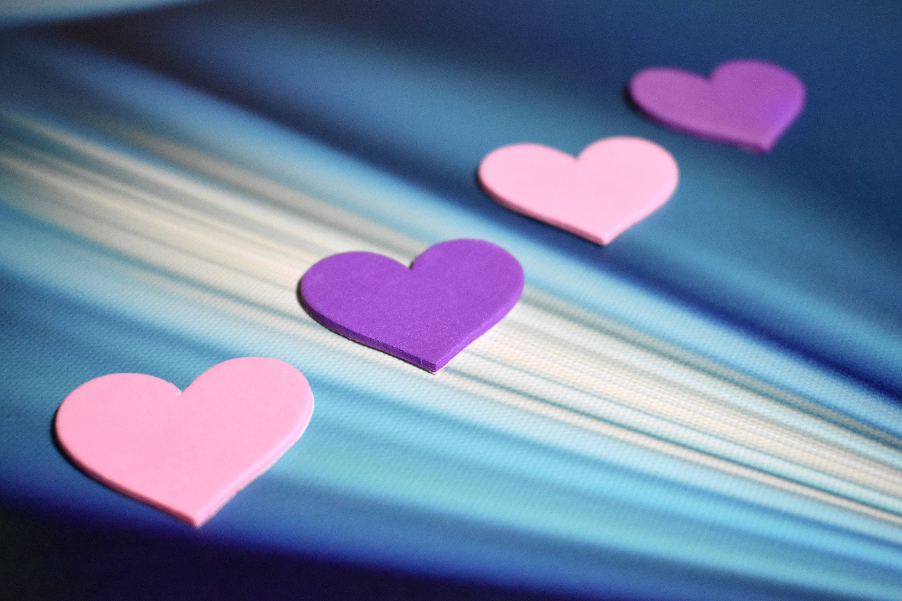 purple heart, pink heart, blue textured surface, 2K Desktop Wallpaper