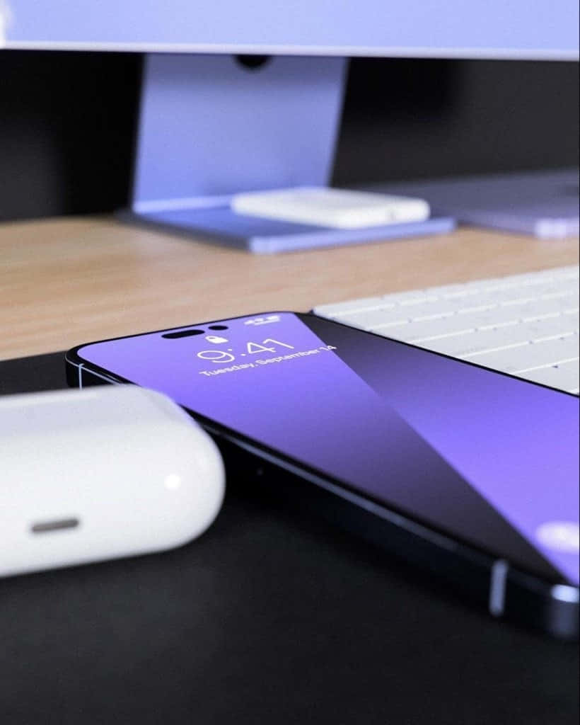 Purple iPhone 14 Pro Max, purple gradient lock screen, desk, SD Phone Wallpaper