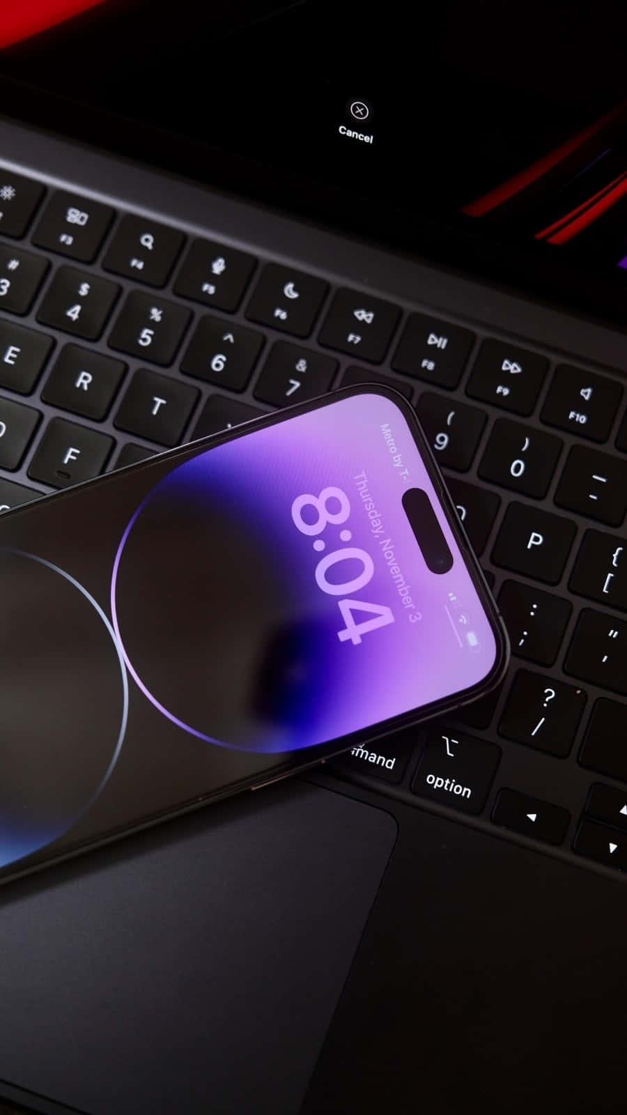 Purple iPhone 14 Pro Max, purple gradient lock screen, black laptop keyboard, HD Phone Wallpaper