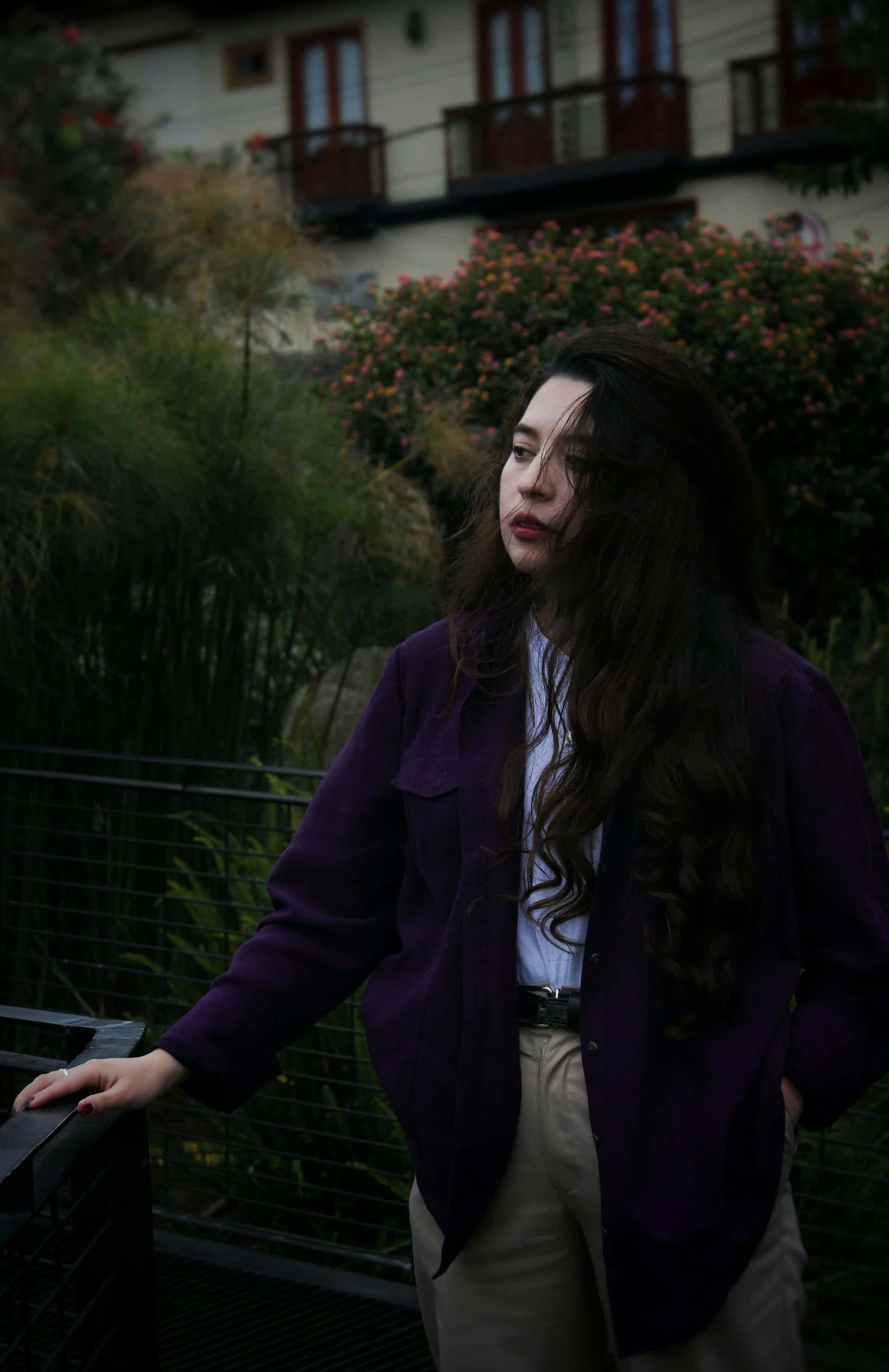 purple jacket, balcony, lush greenery, 2K Phone Wallpaper