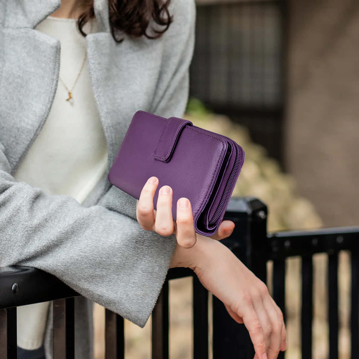 purple leather wallet, gray coat, black metal fence, SD Desktop Wallpaper
