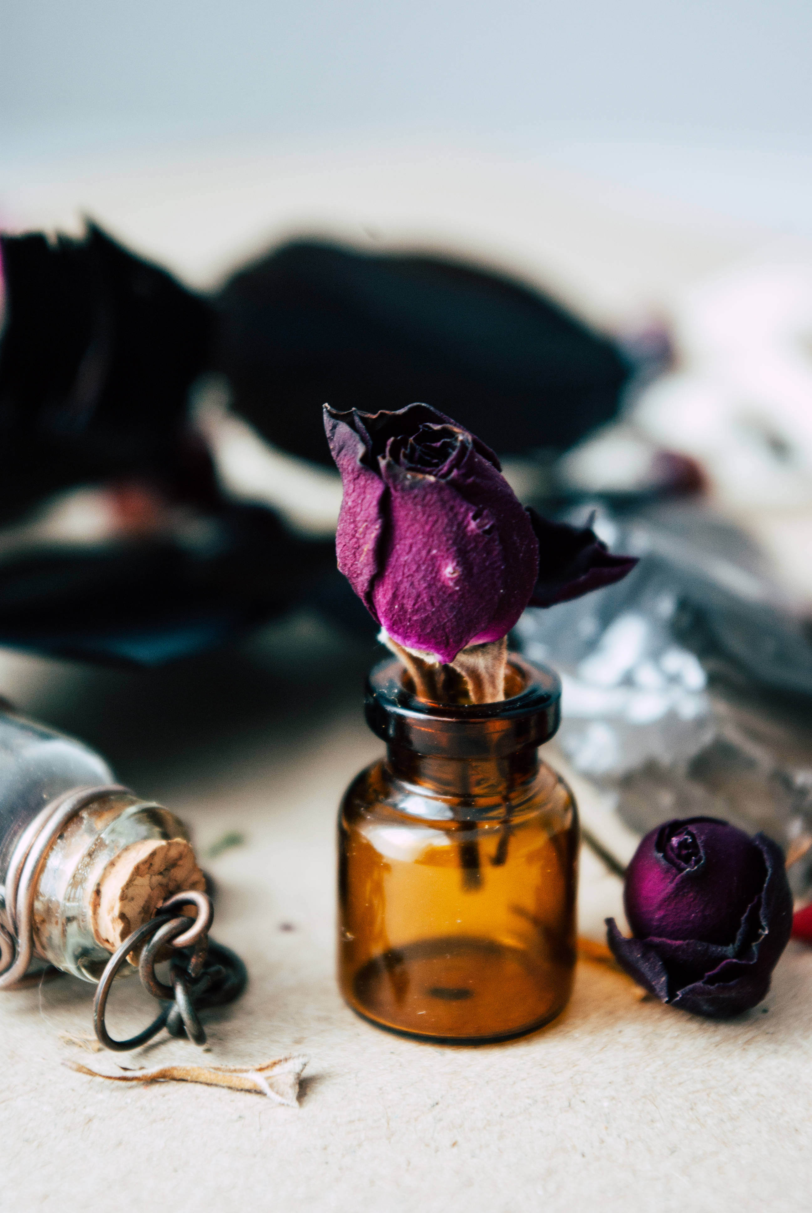 purple rose, small glass container, amber bottle, 4K Phone Wallpaper