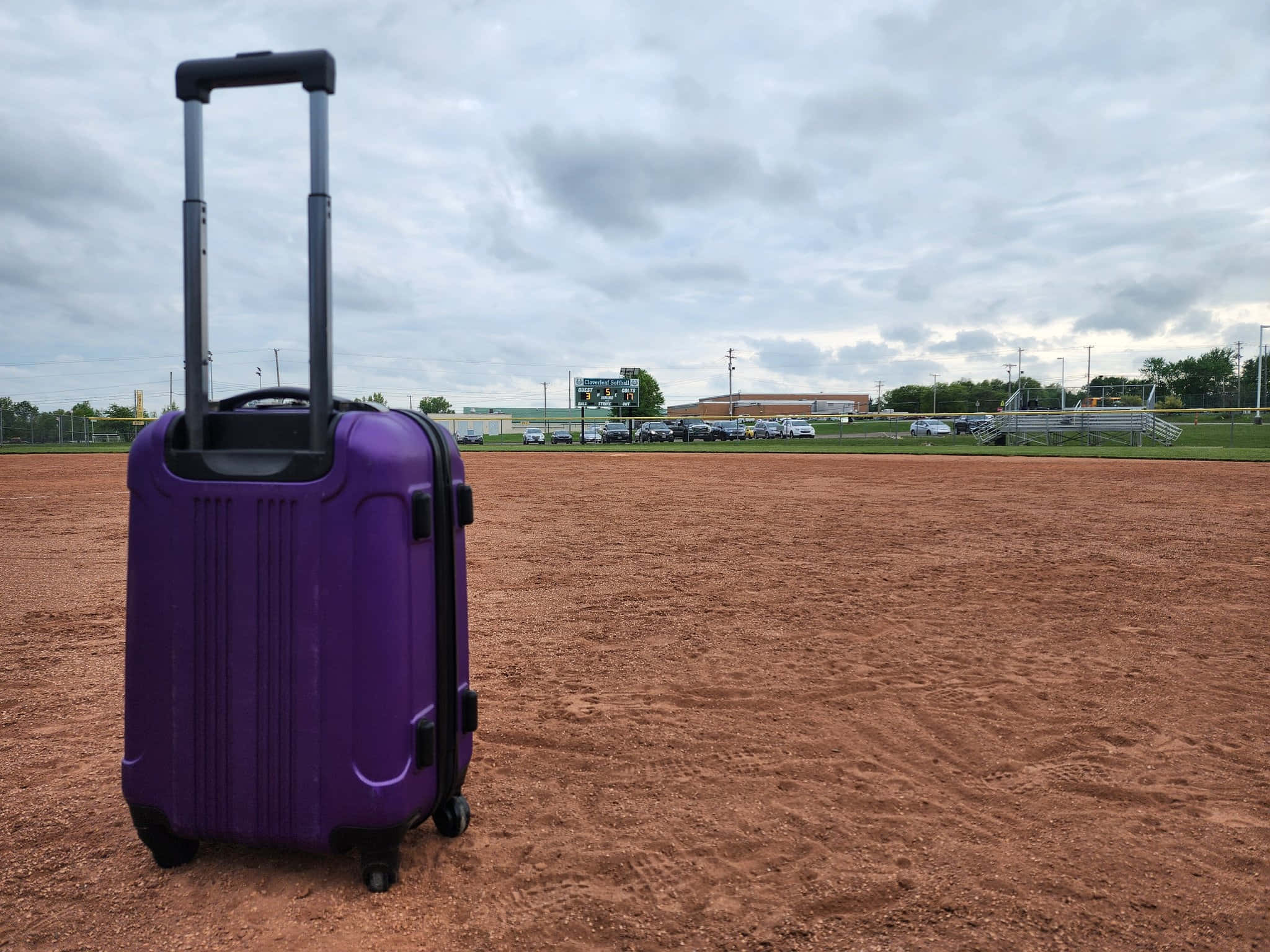 Purple Suitcase, red dirt field, baseball field, Full HD Desktop Wallpaper