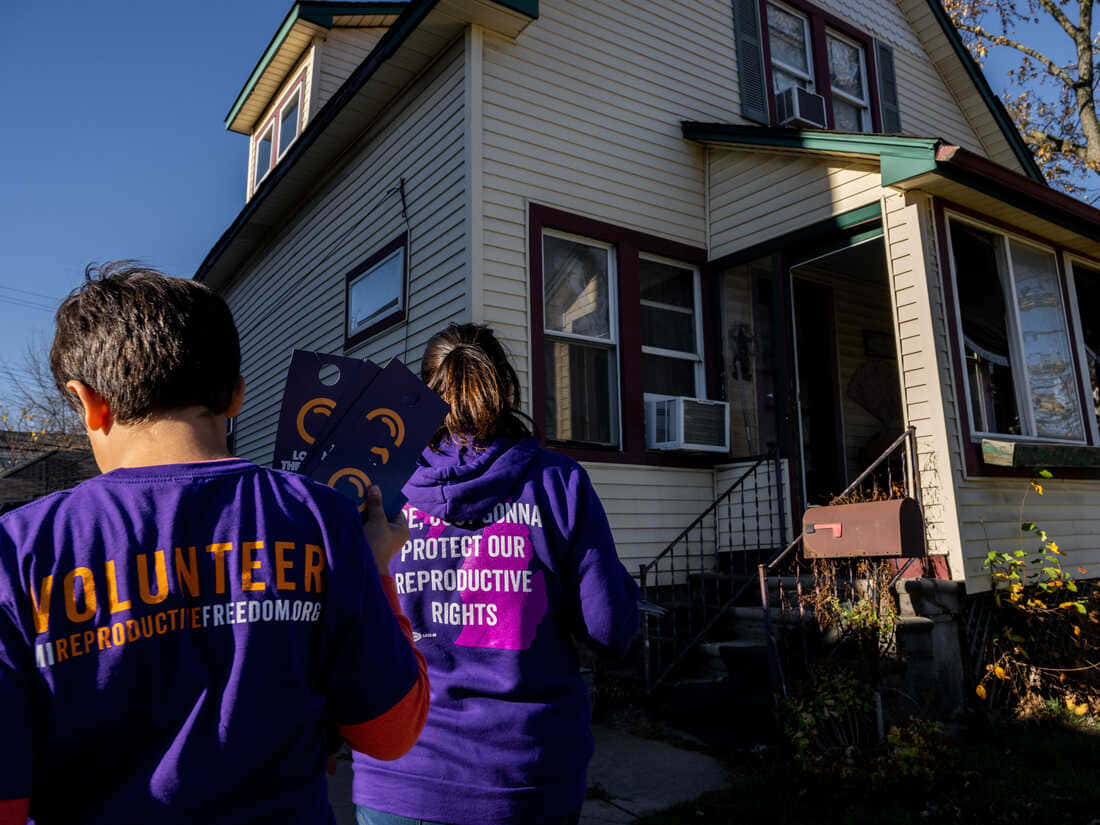 purple t-shirt, reproductive rights, clear blue skies, SD Desktop Wallpaper