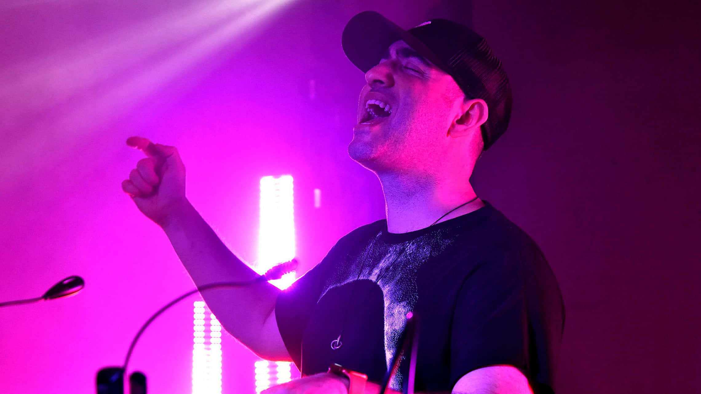 purple t-shirt, vibrant purple stage lights, glowing vertical panels, Full HD Desktop Wallpaper