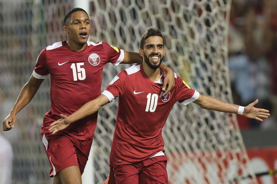 Qatar National Football Team, red jerseys, stadium lights, SD Desktop Wallpaper