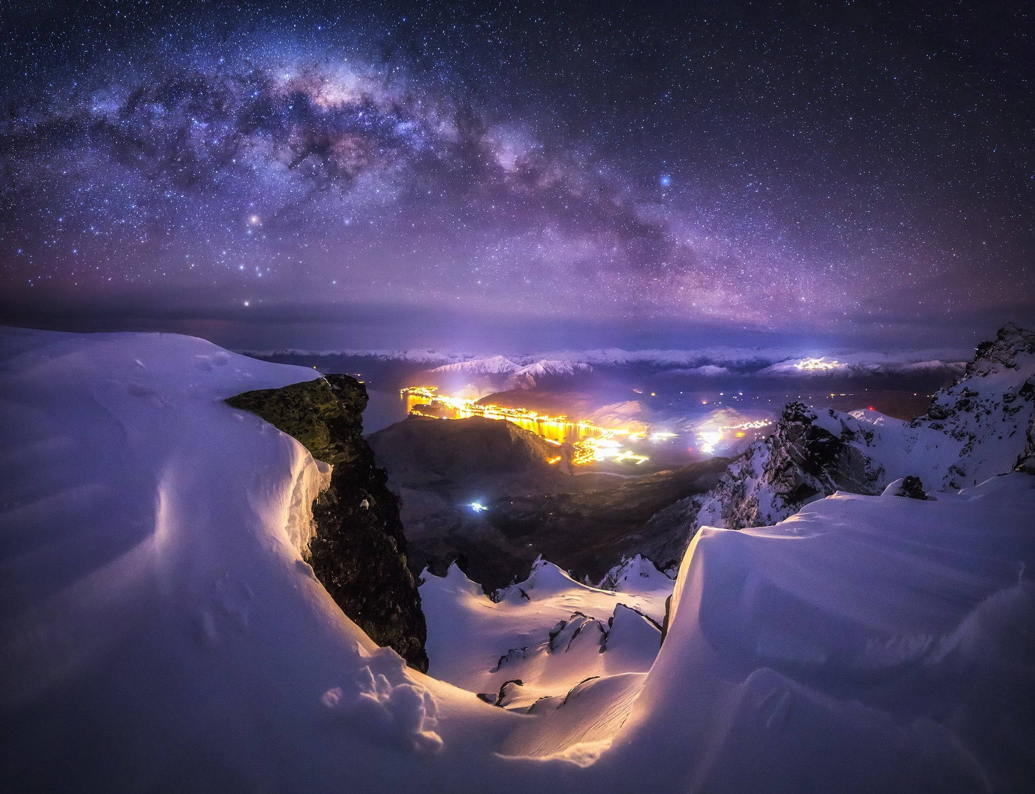 Milky Way galaxy, snowy mountain ridge, glowing valley town, Full HD Desktop Wallpaper