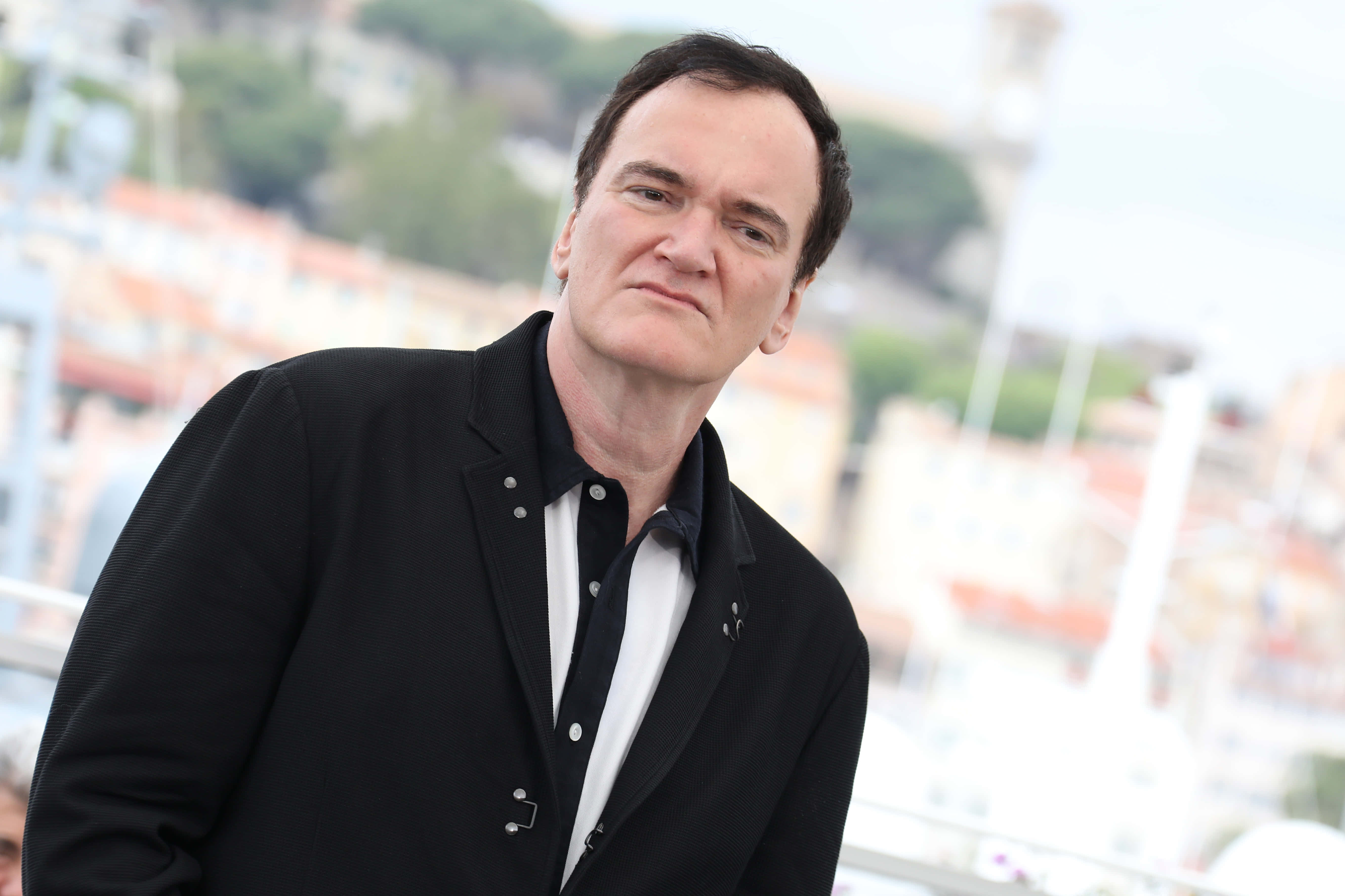 Quentin Tarantino, black blazer, coastal cityscape, 5K Desktop Wallpaper