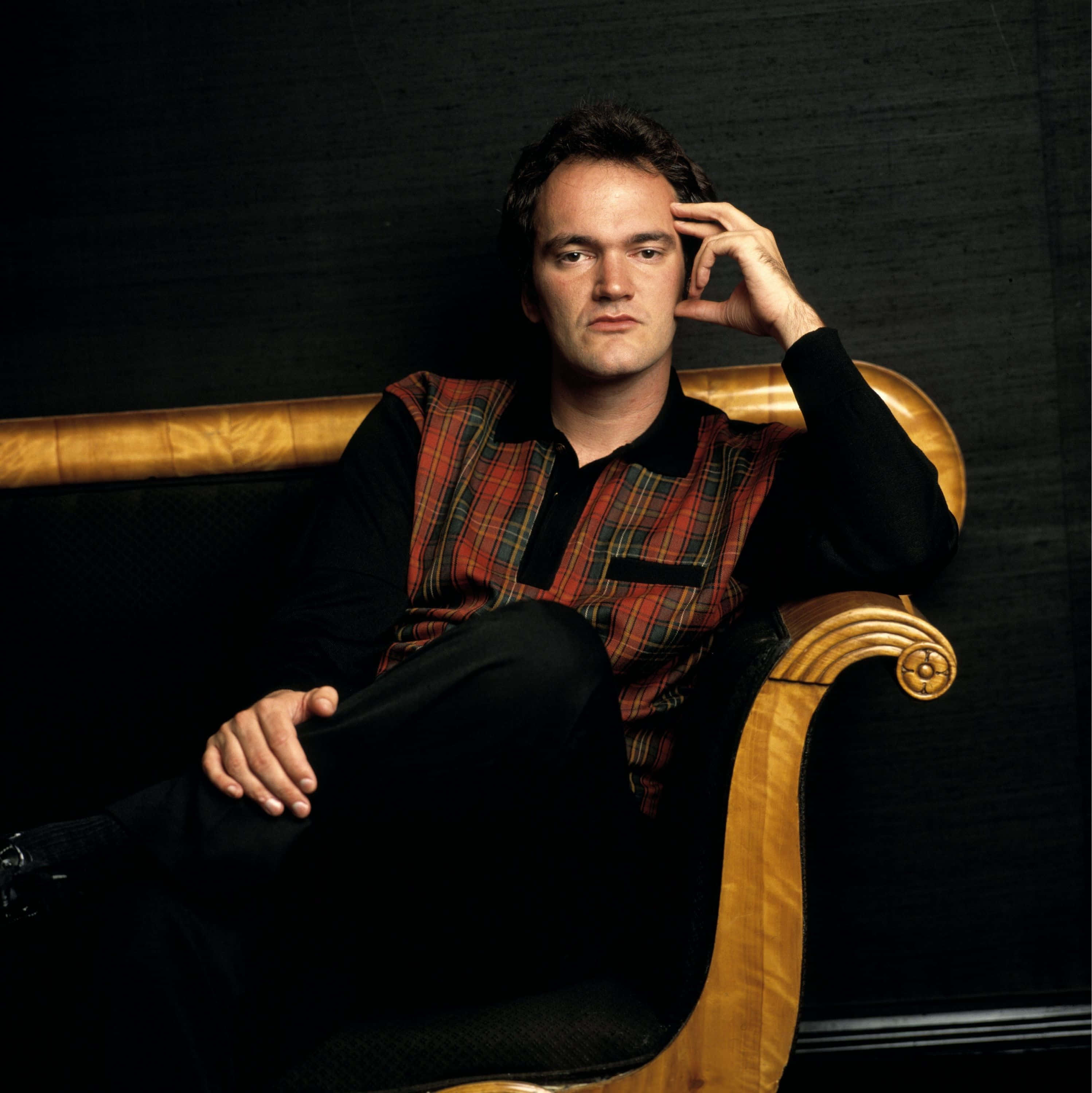 Quentin Tarantino, red plaid vest, ornate wooden chair, 2K Phone Wallpaper