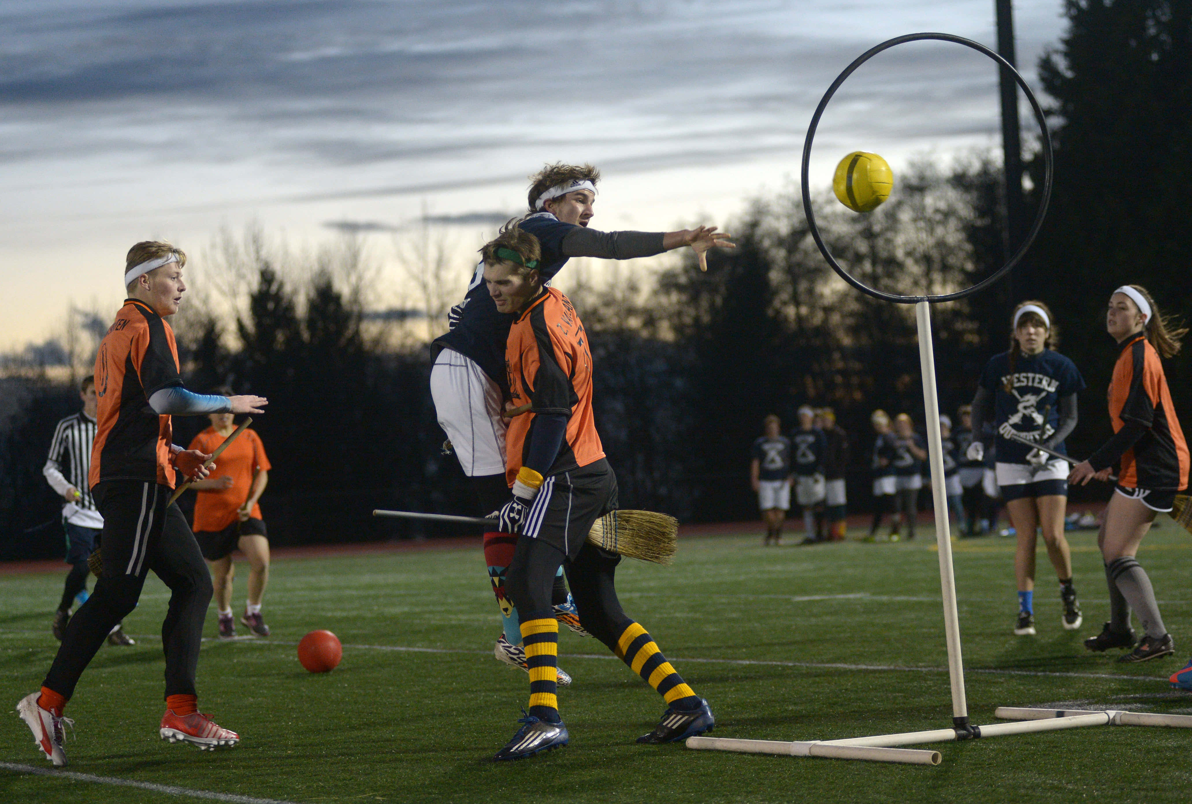 Quidditch, orange and black uniforms, yellow quaffle, 4K Desktop Wallpaper