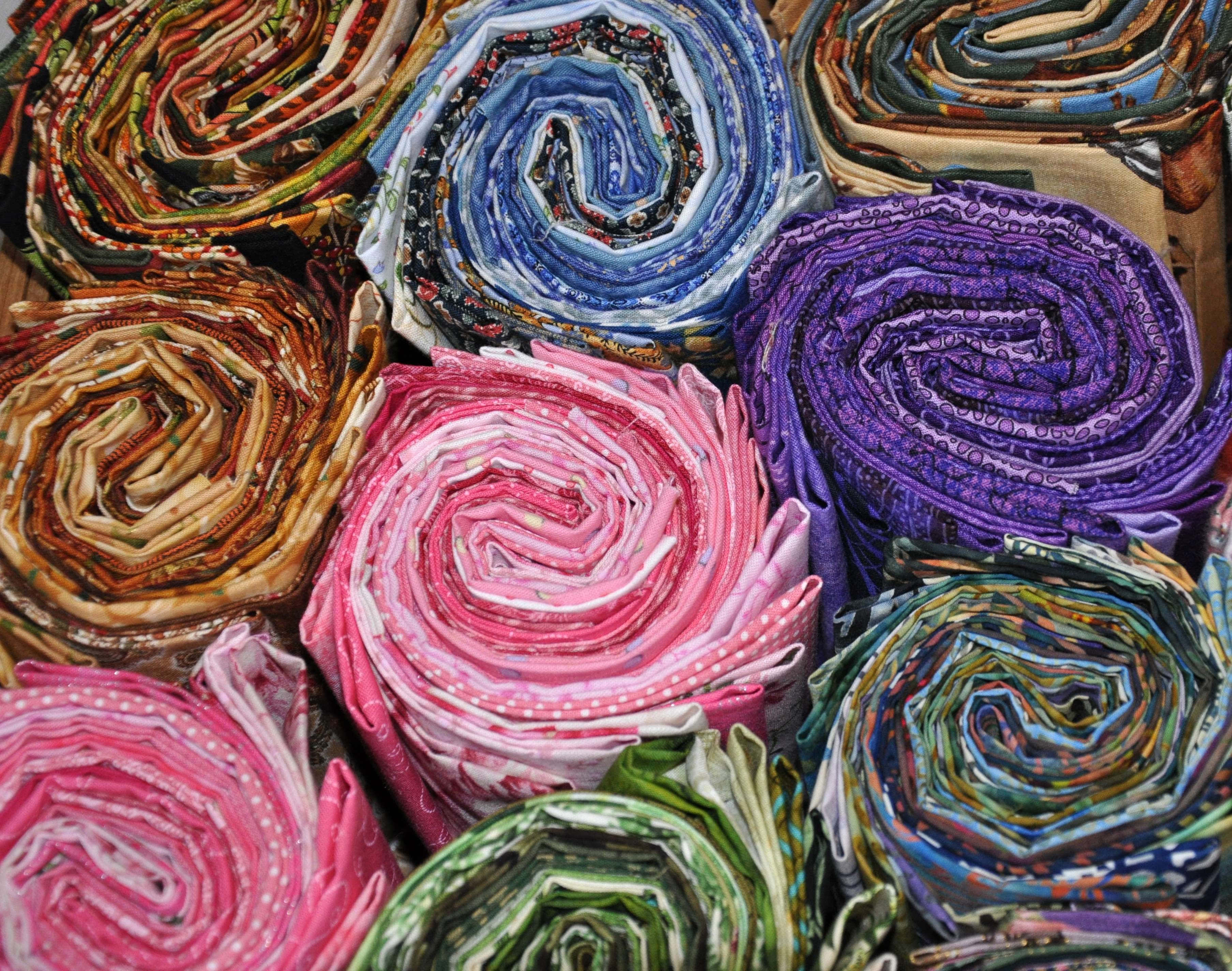 Quilt, Vibrant spiral rolls, patterned fabric, 2K Desktop Wallpaper
