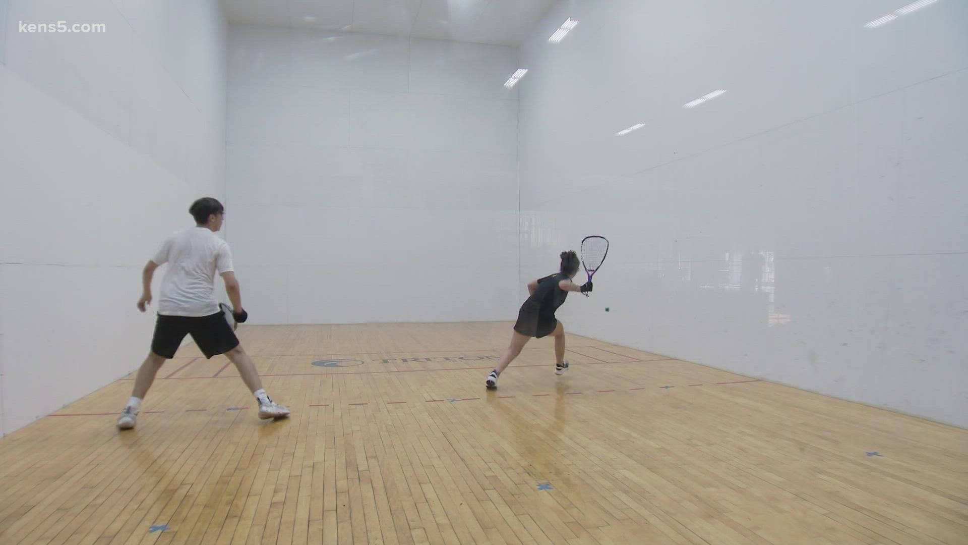 1v1 racquetball match, bright wooden court, white walls, Full HD Desktop Wallpaper