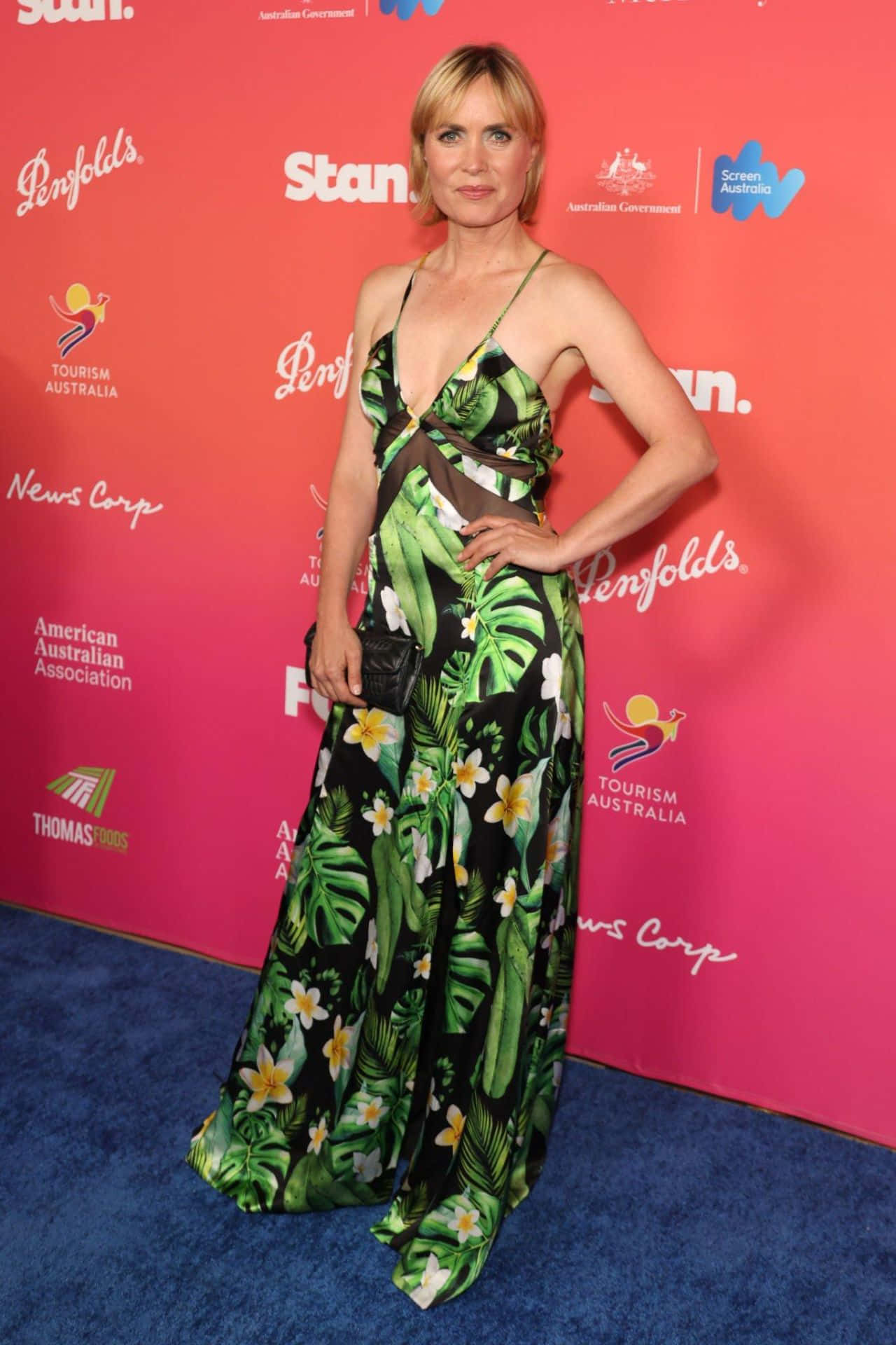 Radha Mitchell, vibrant green tropical print gown, blue carpet, Full HD Phone Wallpaper