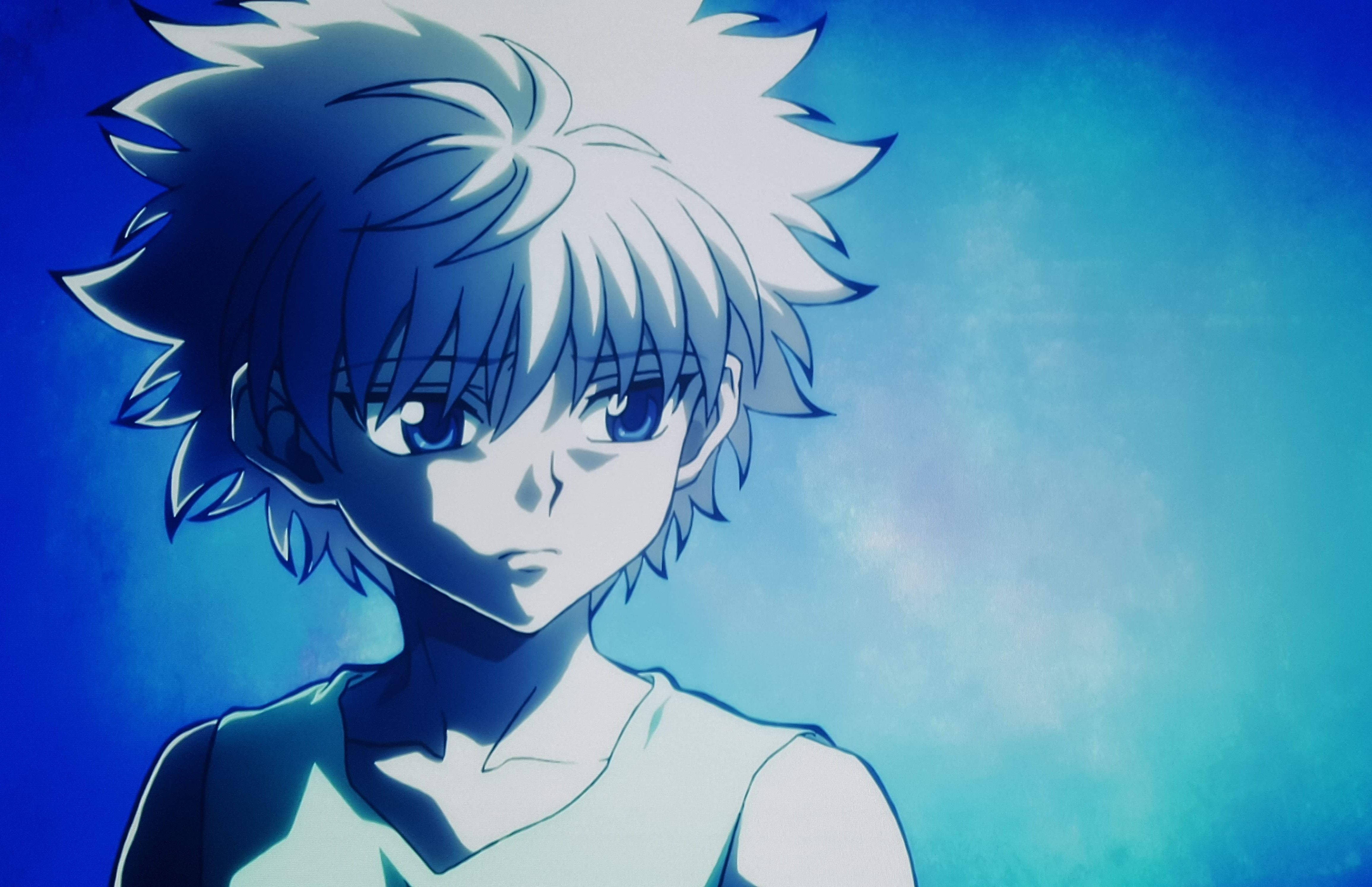 spiky-haired anime boy, intense blue eyes, gradient blue background, 4K Desktop Wallpaper