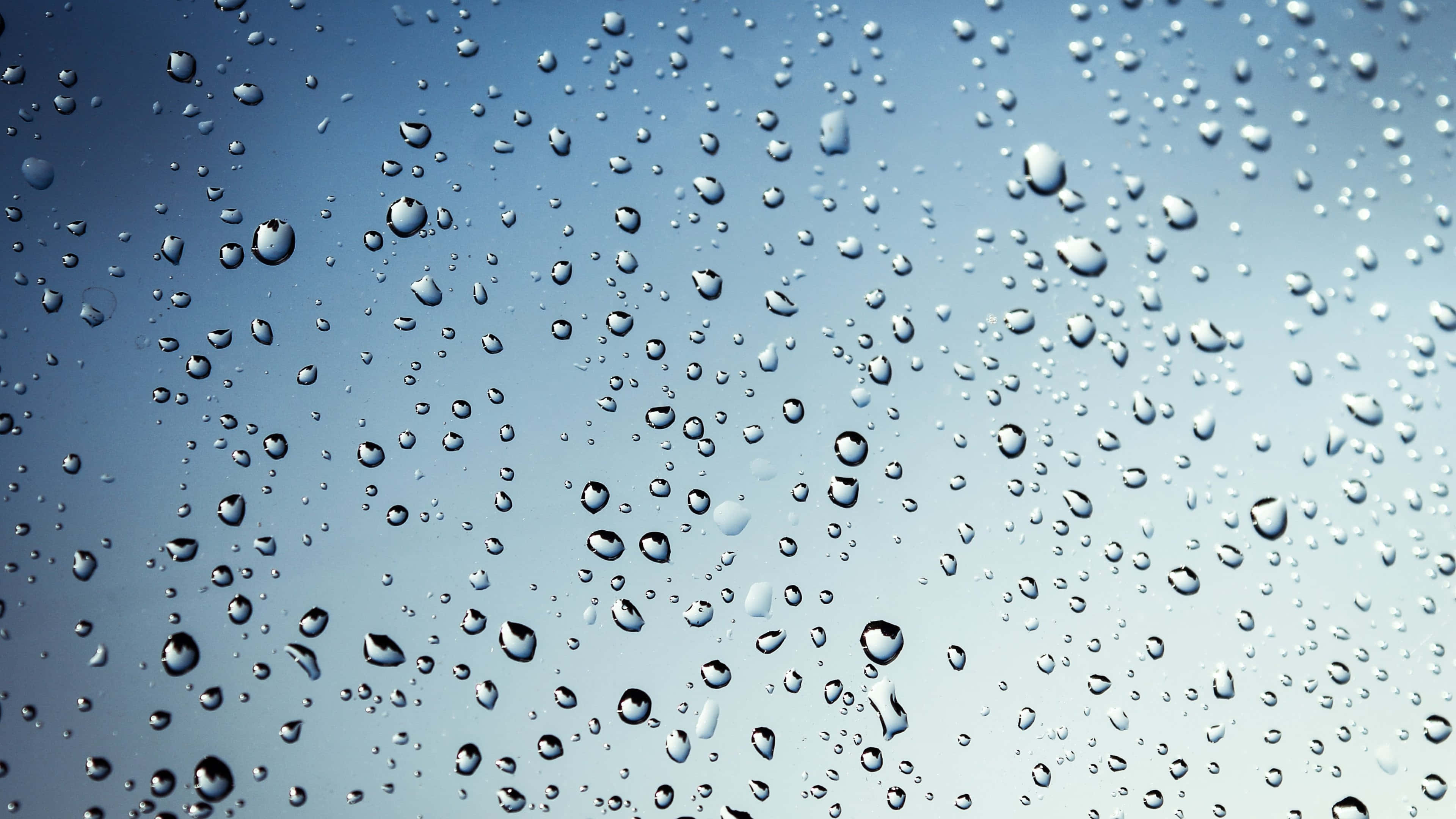 glass surface, raindrops, soft blue sky gradient, 4K Desktop Wallpaper